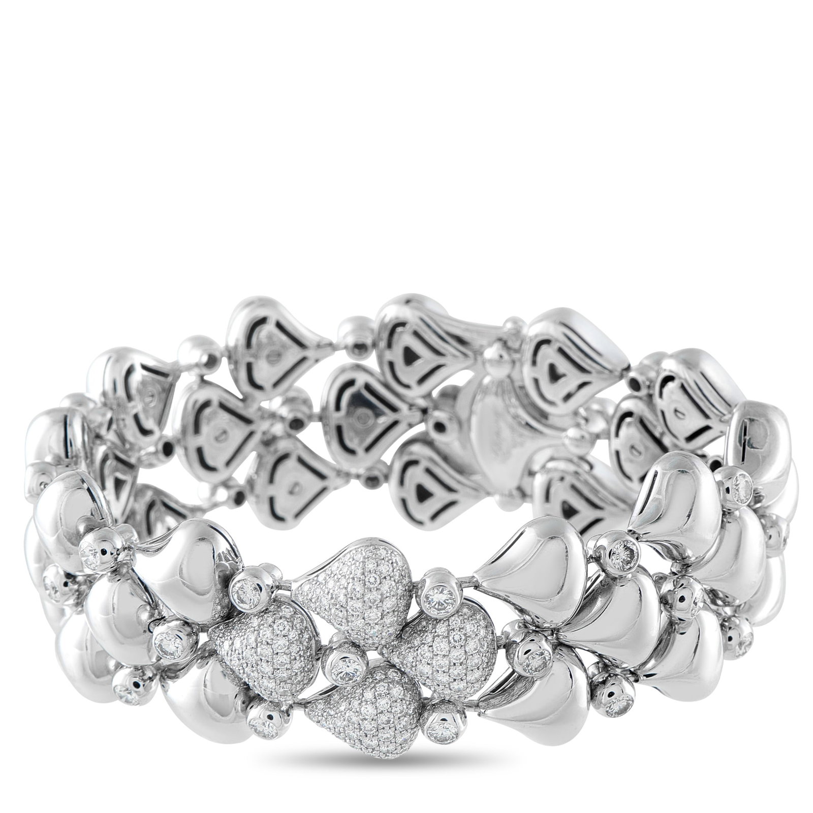 CHOPARD 18K White Gold 6.0ct Diamond Bracelet: This Chopard bracelet is incredibly dynamic in design. Rounded links crafted from 18K White Gold are perfectly paired with bezel-set Diamonds. At the center, additional Diamond accents provide plenty 