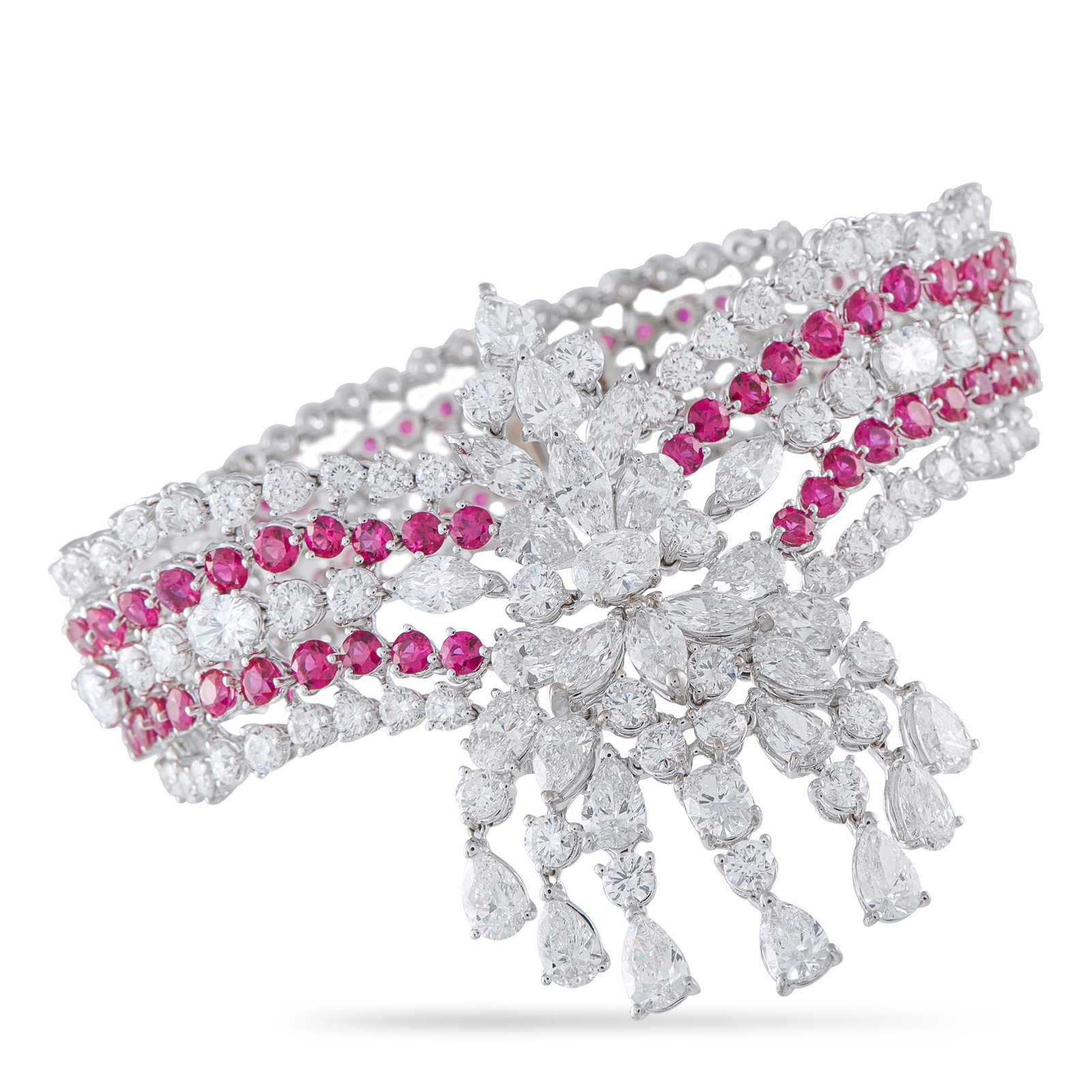 VALENTE MILANO 18K White Gold 24.49ct Diamond and Ruby Bracelet: This Valente Milano bracelet is simply spectacular. Dazzling Diamonds with a total weight of 24.49 carats allow it to effortlessly emanate light. Ruby accents with a total weight of 12.32 carats offer