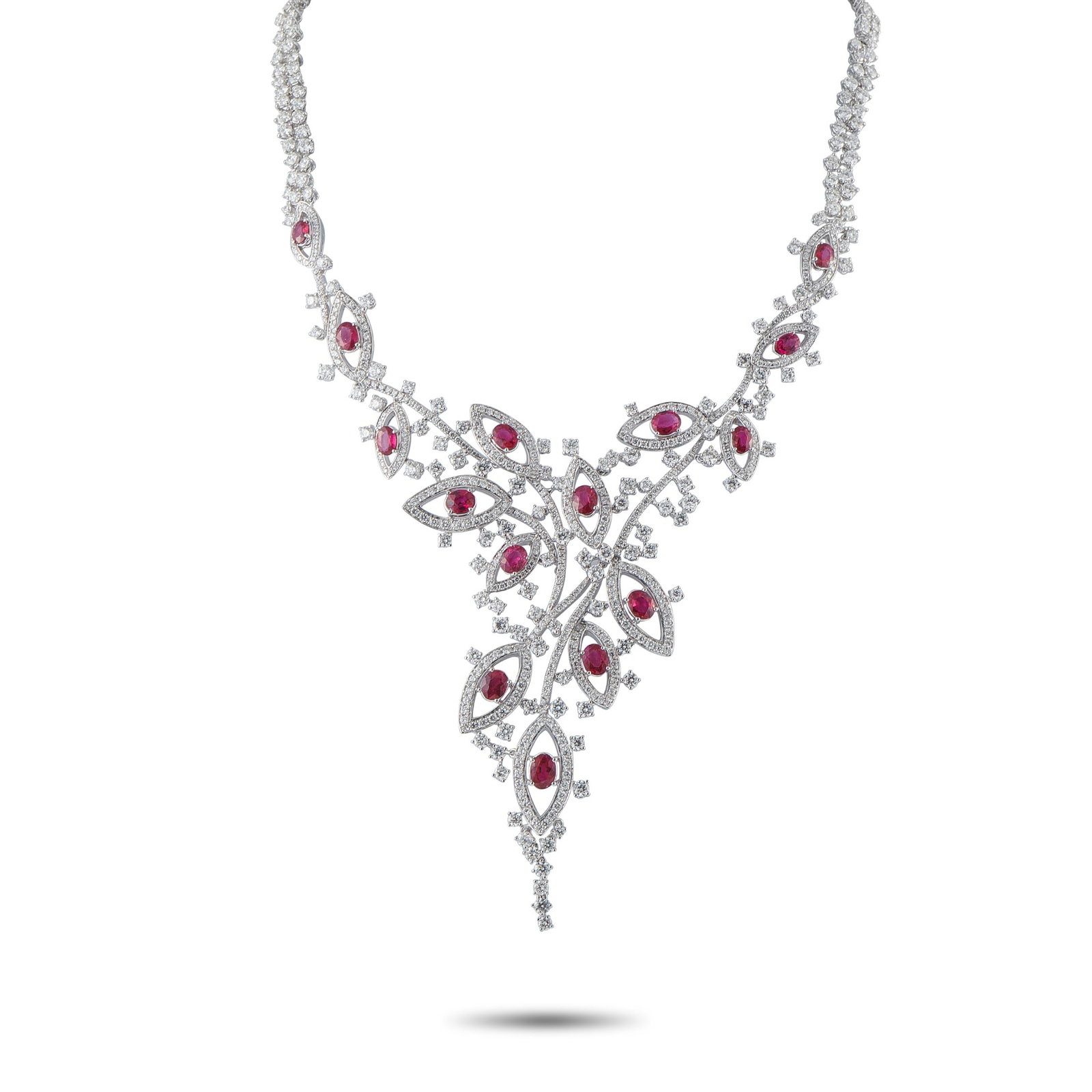 VALENTE MILANO 18K White Gold 23.83ct Diamond and Ruby Necklace: This Valente Milano necklace pairs stunning craftsmanship with artistic elegance. Crafted from 18K White Gold, organic shapes take center stage on this piece’s central design. Sparkling Diamonds tot