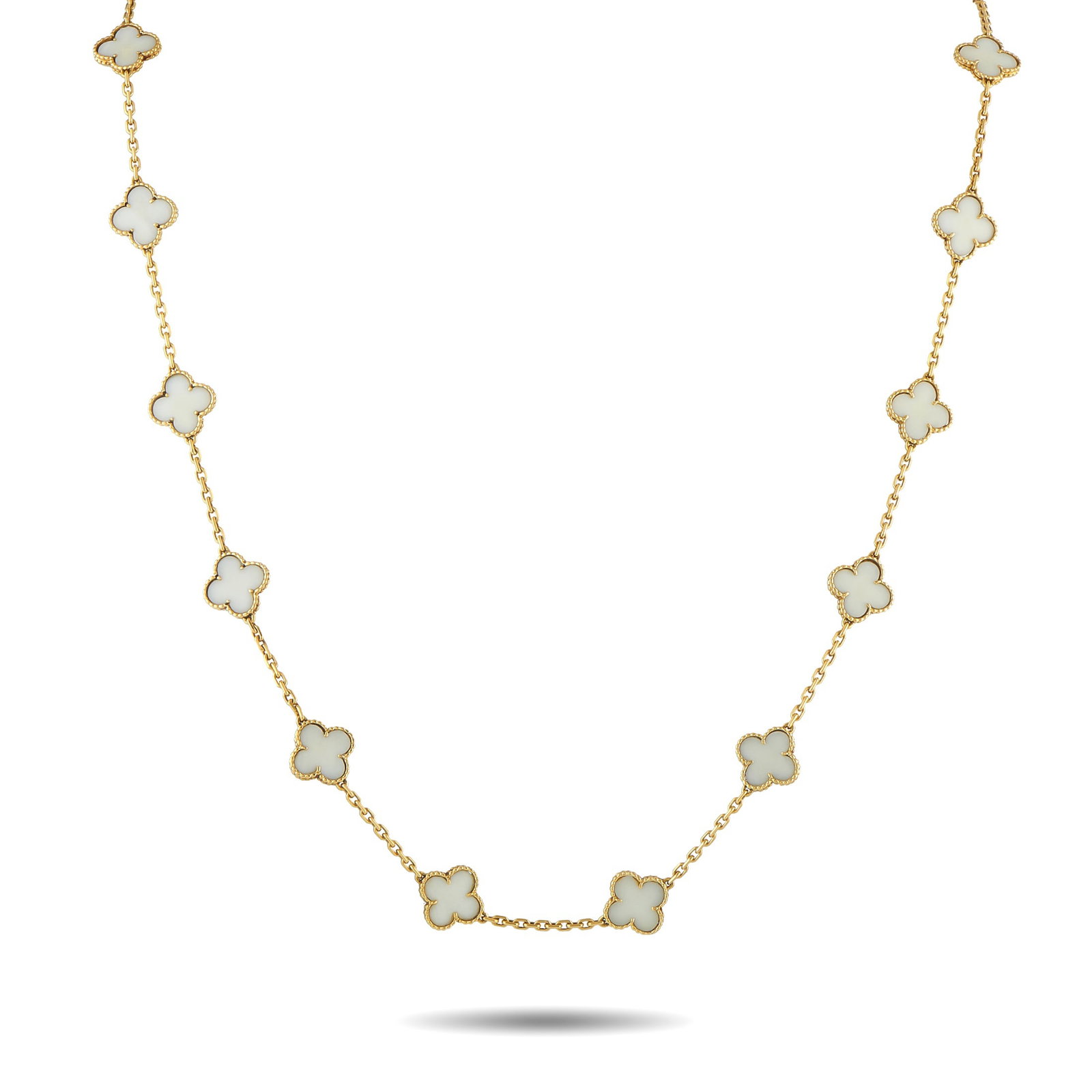 VAN CLEEF & ARPELS Van Cleef & Arpels Vintage Alhambra 18K Yellow Gold White Coral 20-Motif Necklace: This Van Cleef & Arpels Vintage Alhambra necklace is an instantly recognizable piece that exudes timeless luxury. Crafted from 18K Yellow Gold, a series of 20 of the brand’s iconic clover-shaped mot