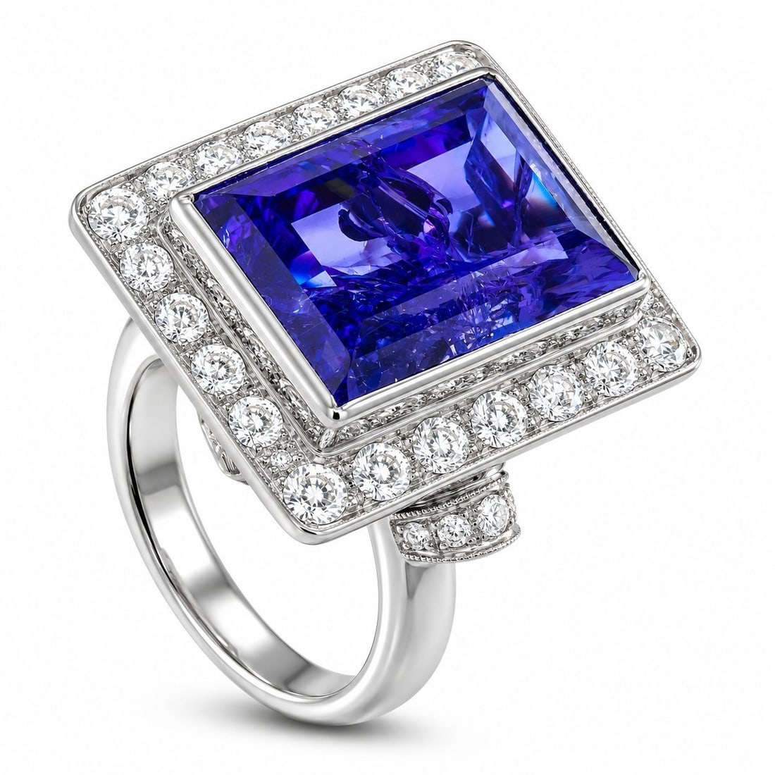 18K White Gold Diamond and Tanzanite Ring: 18K White Gold Diamond and Tanzanite Ring A detailed 18K White Gold setting makes this ring elegant from any angle. Sparkling Diamonds surround this piece’s breathtaking 15.0 carat Tanzanite center 