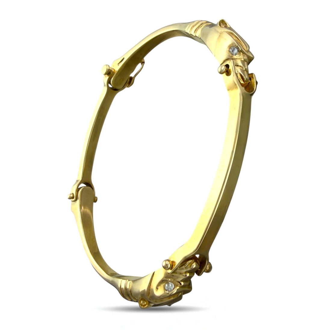 14K Yellow Gold 0.12ct Diamond Cheetah Head Link Bracelet: 14K Yellow Gold 0.12ct Diamond Cheetah Head Link Bracelet This exceptional bracelet is crafted in solid 14 karat yellow gold and designed as a bold sequence of sculptural cheetah head links. Each arti
