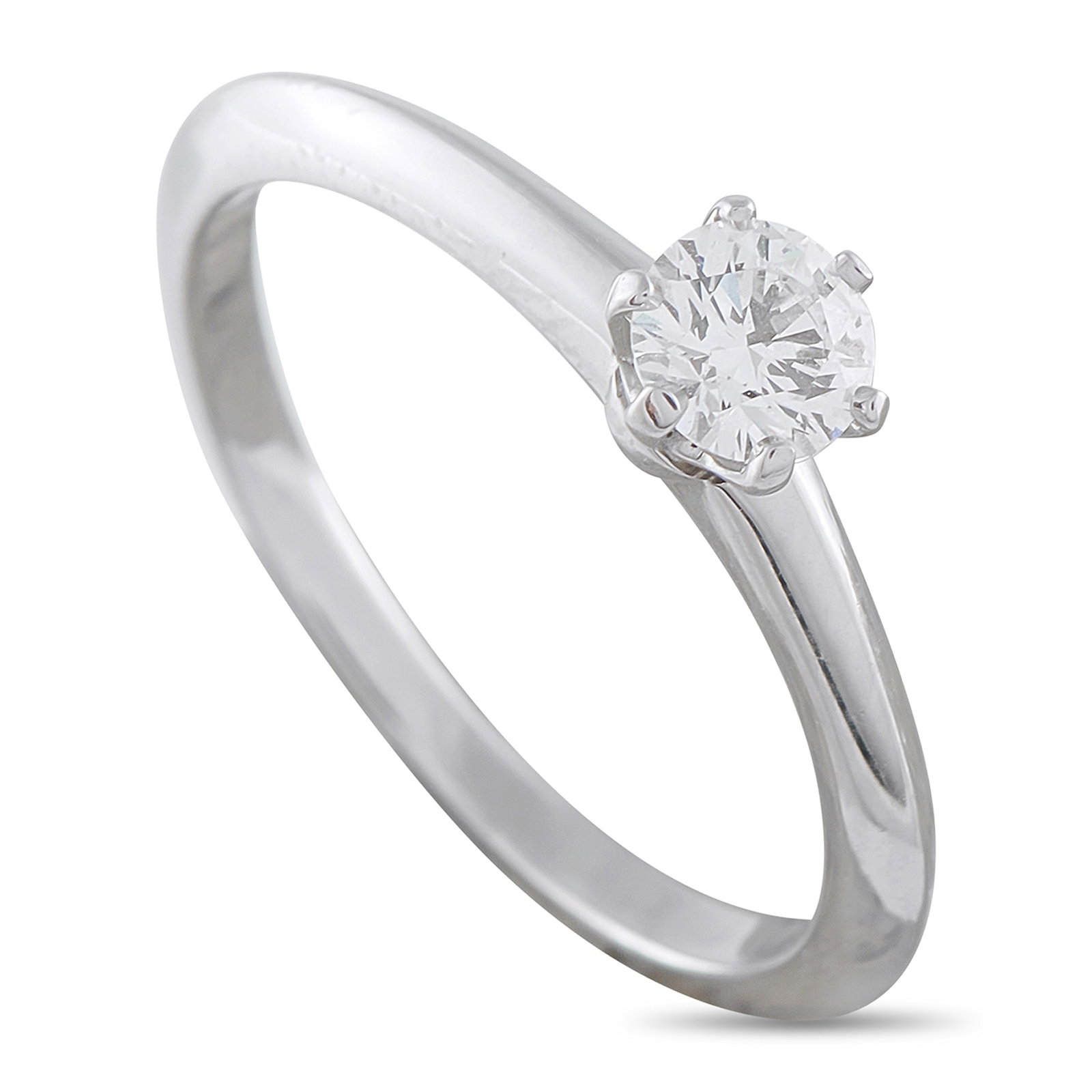 Tiffany & Co. Platinum 0.29ct Diamond Solitaire Engagement Ring: A 0.29 carat Round Brilliant Diamond with F color and VS2 clarity makes a statement at the center of this Tiffany & Co. solitaire engagement ring. Ideal for anyone with a minimalist aesthetic, the Pla
