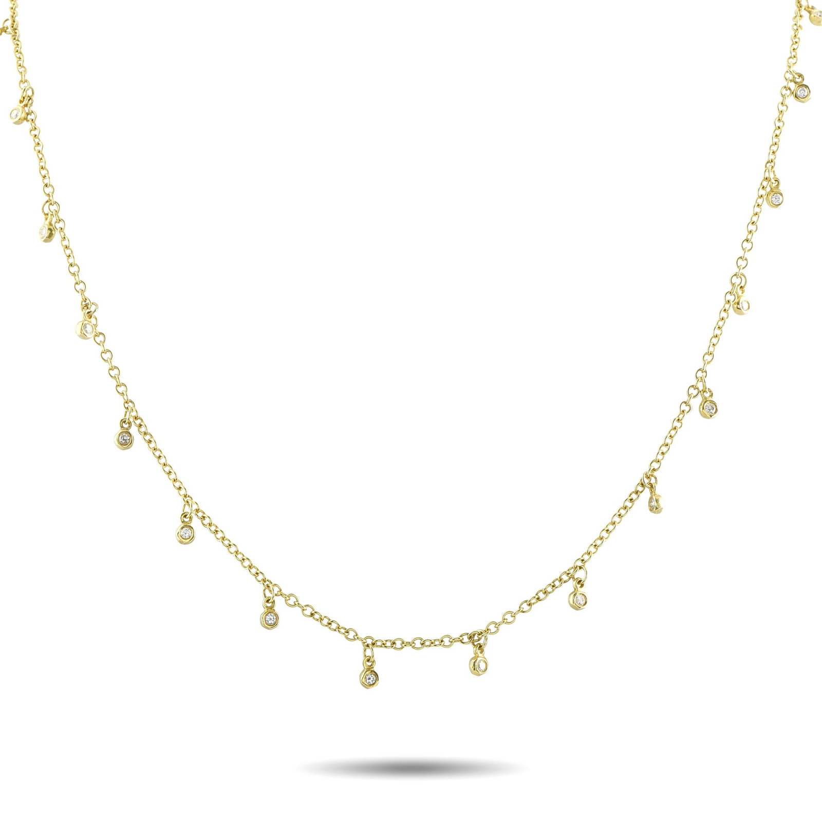 Ippolita 18K Yellow Gold 1.05ct Diamond Long Necklace: Crafted in 18K yellow gold, this Ippolita necklace measures 32 inches long and drapes with graceful fluidity along the neckline. Its delicate chain is accented with evenly spaced bezel-set round diamo