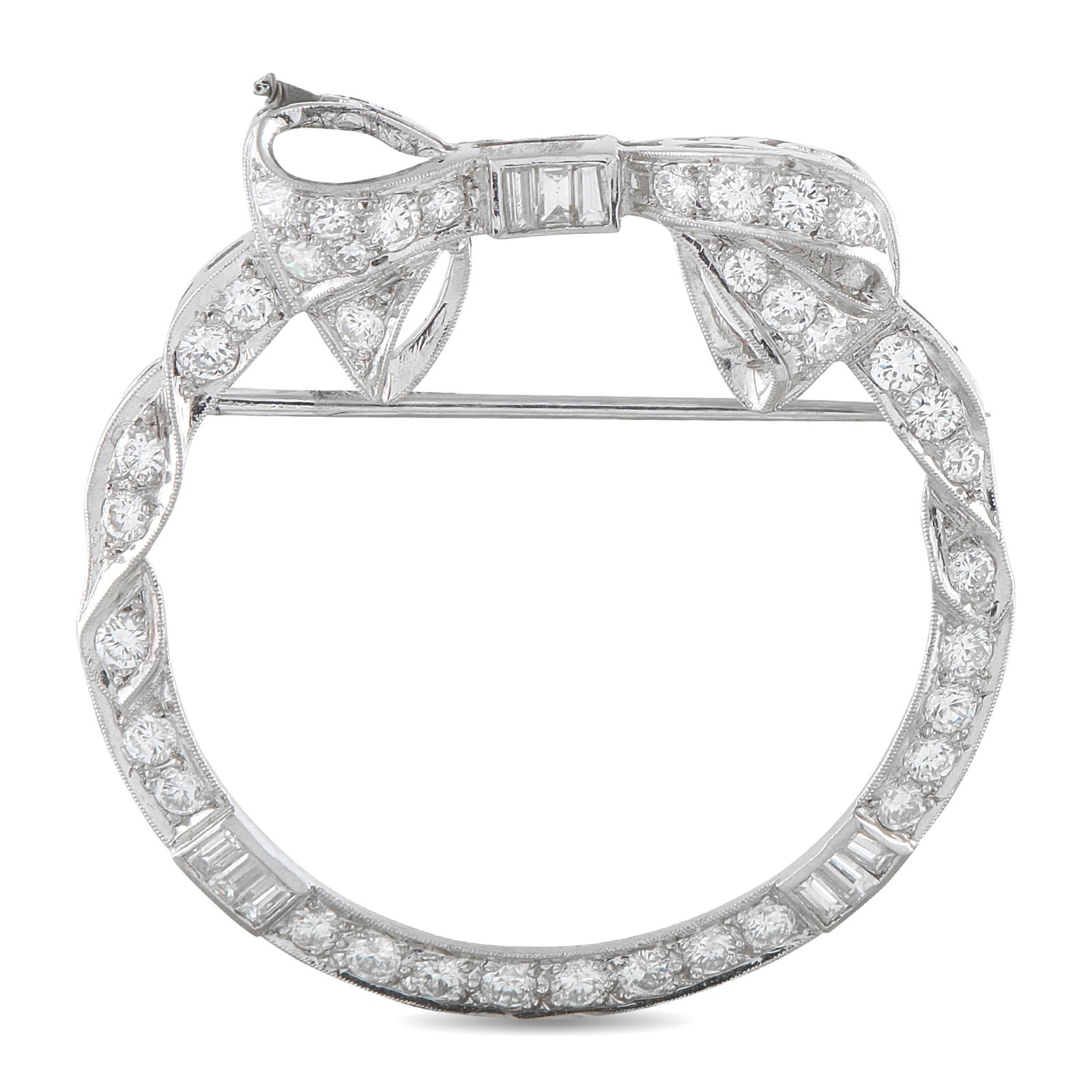 Platinum 1.30ct Diamond Circular Bow Brooch: This brooch will add a feminine finishing touch to any outfit. Incredibly charming, the Platinum setting features a ribbon-like design complete with a delicate bow detail. Diamonds with a total weight