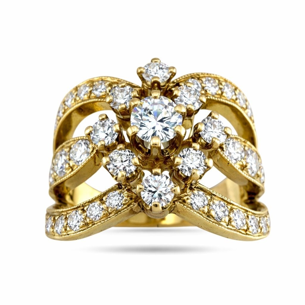 14K Yellow Gold 1.5ct Diamond Cluster Ring: 14K Yellow Gold 1.5ct Diamond Cluster Ring An elegant sculptural ring crafted in warm yellow gold, featuring flowing rows of diamonds that gracefully rise toward a brilliant center stone. The design c