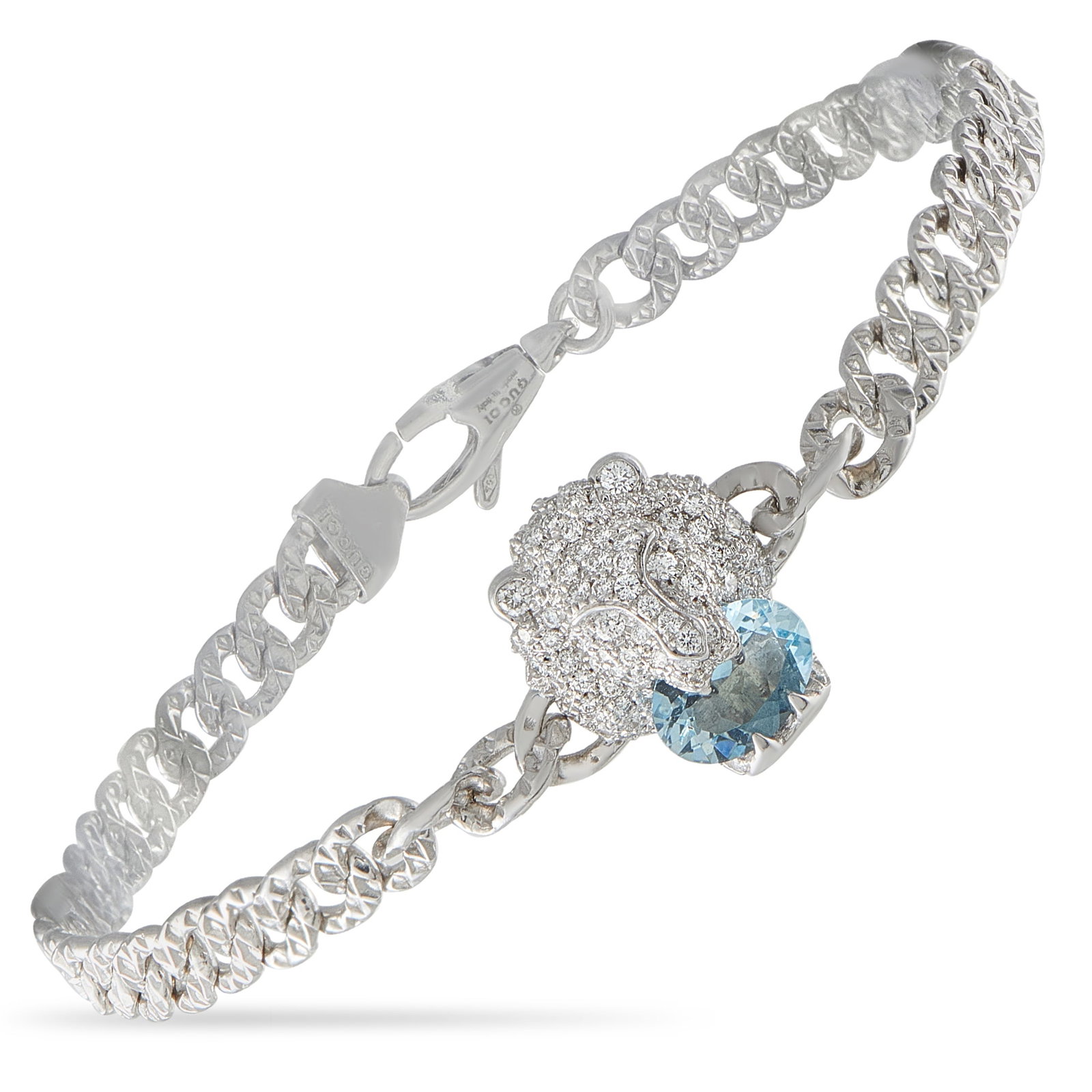 Gucci 18K White Gold Diamond and Aquamarine Lion Bracelet: This Gucci bracelet is incredibly chic. Crafted from 18K White Gold, the lion head motif is covered in sparkling Diamonds. A breathtaking Aquamarine gemstone provides a fabulous finishing touch. It me