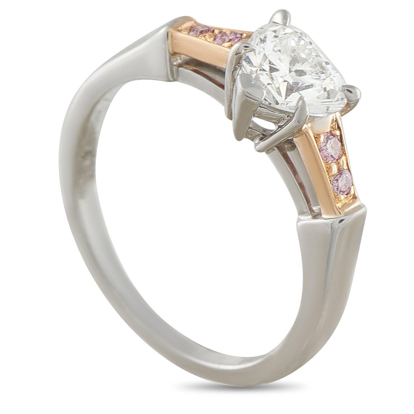 Harry Winston Platinum and 18K Rose Gold 0.72ct Diamond Ring: A stunning two-toned design makes this Harry Winston ring a charming addition to any luxury collection. At the center of the Platinum band, a 0.72 carat heart-shaped Diamond serves as a stunning focal