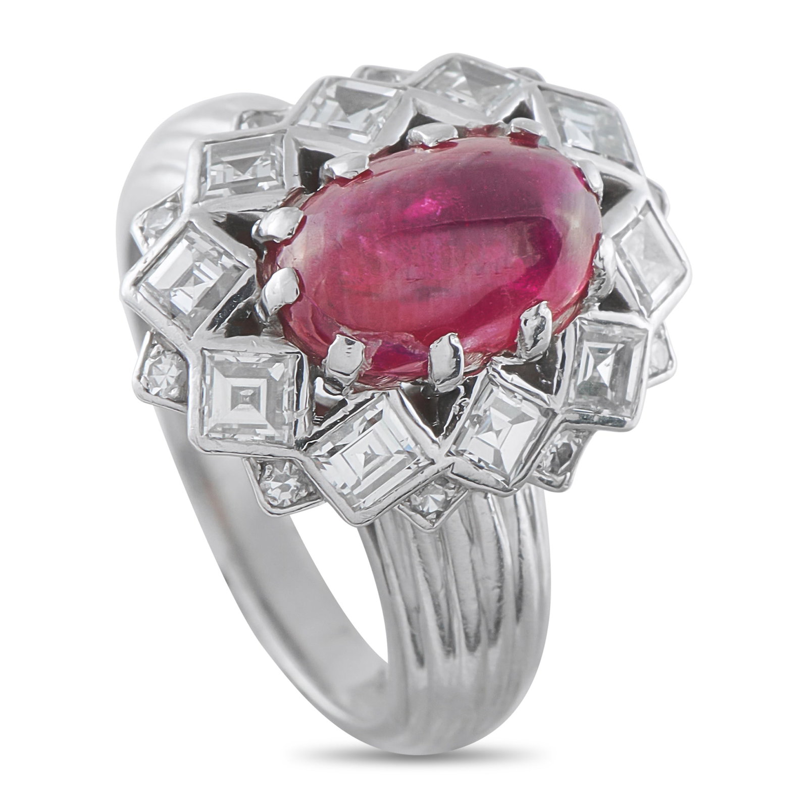 Mauboussin Platinum 1.30ct Diamond and Ruby Ring: This Mauboussin ring is an exciting piece that will continually capture your imagination. The dynamic Platinum setting is elevated by Diamonds totaling 1.30 carats. At the center, a 2.60 carat Ruby ca