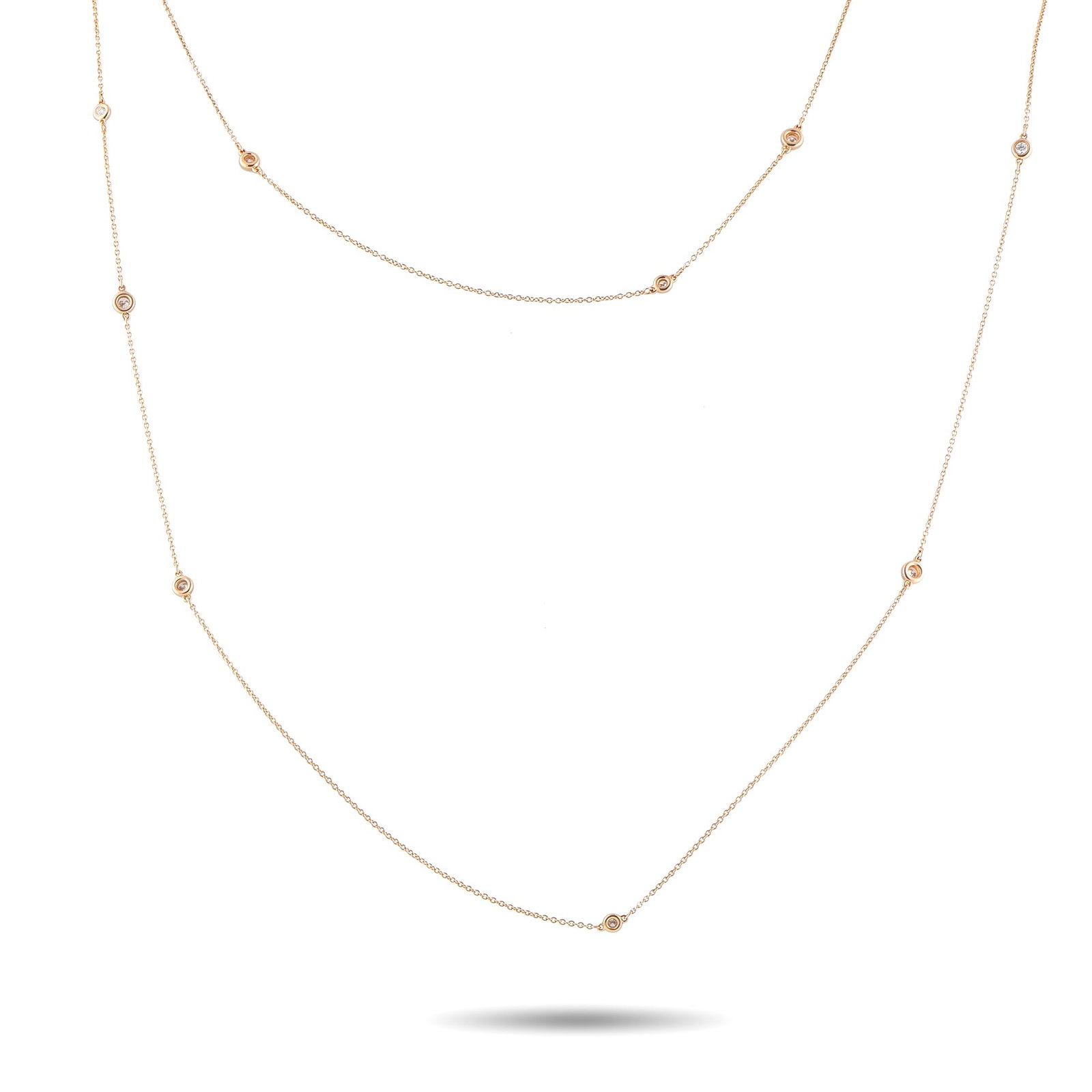 Tiffany & CO. Diamonds by the Yard 18K Rose Gold 2.50ct Diamond Necklace: Add a touch of sophistication to any ensemble with this simple, elegant Tiffany & Co. Diamonds by the Yard necklace. This piece is crafted from 18K Rose Gold and features a series of bezel-set Diamond