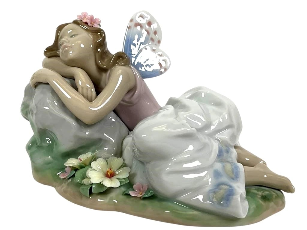 Lladro Limited Edition Porcelain Princess of the Fairies 7694: Lladro Limited Edition Porcelain Princess of the Fairies 7694Porcelain figurine by Lladro titled Princess of the Fairies, model #7694. Depicts a reclining fairy with pastel floral details and butterfl