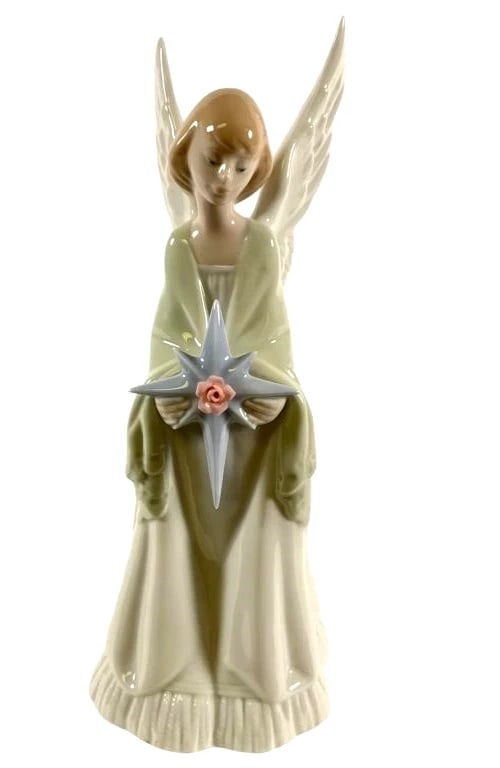Lladro Porcelain Star of the Heavens 6792: Lladro Vintage Limited Edition Porcelain Star of the Heavens 6792Lladro porcelain figurine titled 'Star of the Heavens,' model number 6792. Features an angel figure holding a star with a pink rose at 