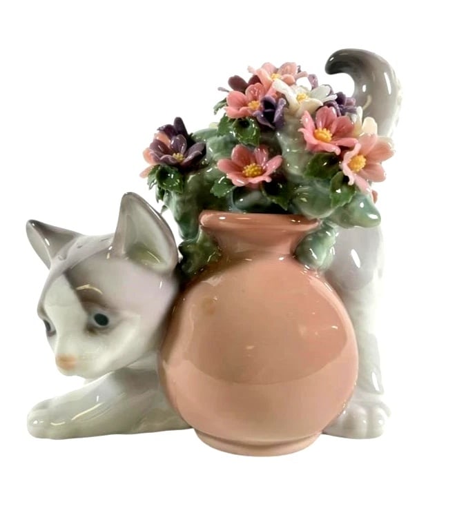 Lladro Secret Spot 6566 Porcelain Figurine: Lladro Vintage Limited Edition Secret Spot 6566Lladro porcelain figurine titled Secret Spot, model number 06566. Features a playful cat hiding behind a peach-colored vase adorned with detailed pastel 