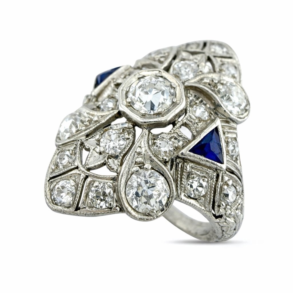 Platinum Art Deco 1.07ct Diamond and Sapphire Ring: Platinum Art Deco 1.07ct Diamond and Sapphire Ring This exquisite Art Deco ring in platinum is accented with a harmonious arrangement of vibrant sapphires. Each stone is meticulously set to emphasize 
