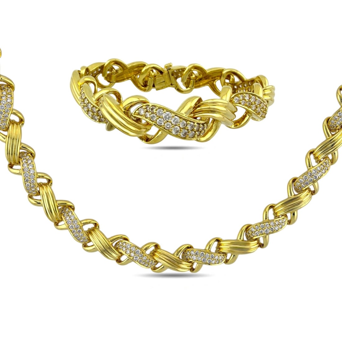 Jose Hess 18K Yellow Gold 7ct Diamond Necklace and Bracelet Suite: Jose Hess 18K Yellow Gold 7ct Diamond Necklace and Bracelet Suite A luxurious and impeccably crafted jewelry suite by renowned designer Jose Hess, featuring a matching necklace and bracelet with his s