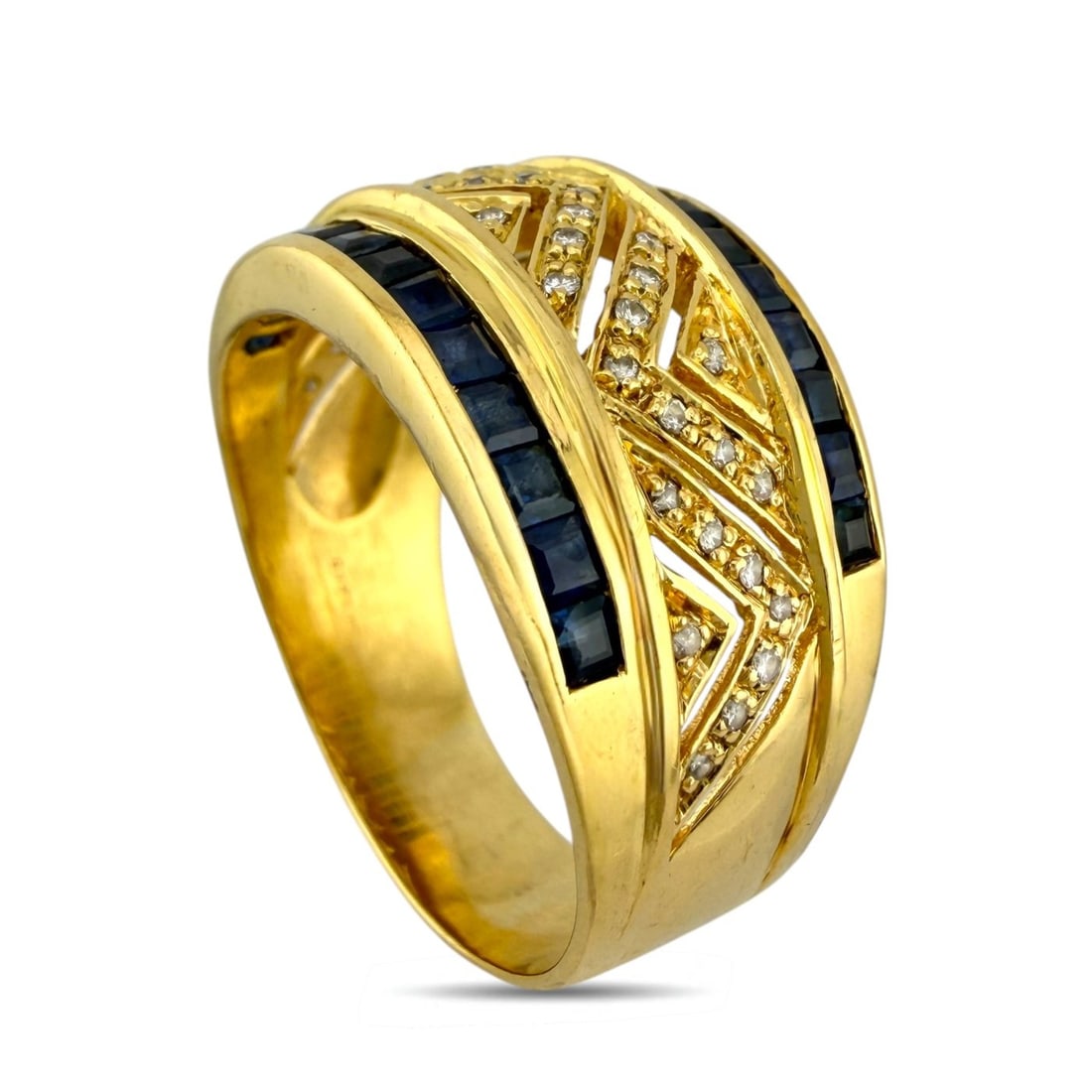 14K Yellow Gold 0.27ct Diamond and Sapphire Ring: 14K Yellow Gold 0.27ct Diamond and Sapphire Ring A striking vintage piece from Thailand, this ring presents a bold yet refined design with a rich interplay of sparkle and color. The deep-toned princes