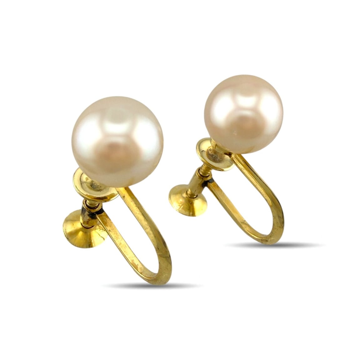 Mikimoto 18K Yellow Gold Conch Pearl Earrings: Mikimoto 18K Yellow Gold Conch Pearl Earrings A refined pair of vintage Mikimoto earrings crafted in yellow gold and set with elegant conch pearls. The soft natural presence of the pearls, paired with
