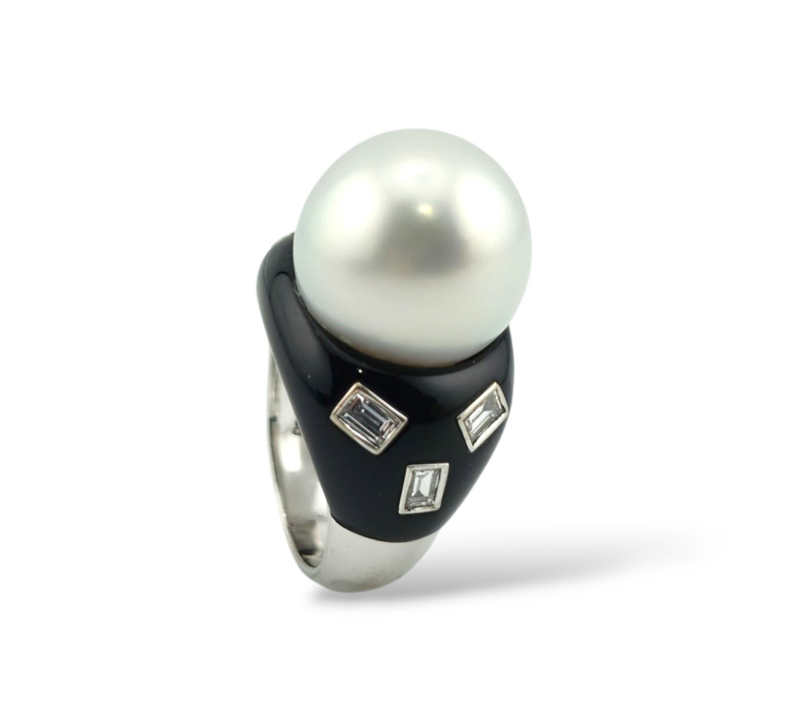 Art Deco 18K White Gold Ring with Pearl, Onyx and Emerald-Cut Diamonds: Art Deco 18K White Gold Ring with Pearl, Onyx and Emerald-Cut Diamonds A striking example of Art Deco design, this 18K white gold ring captures the era's signature contrast and geometry through its ha