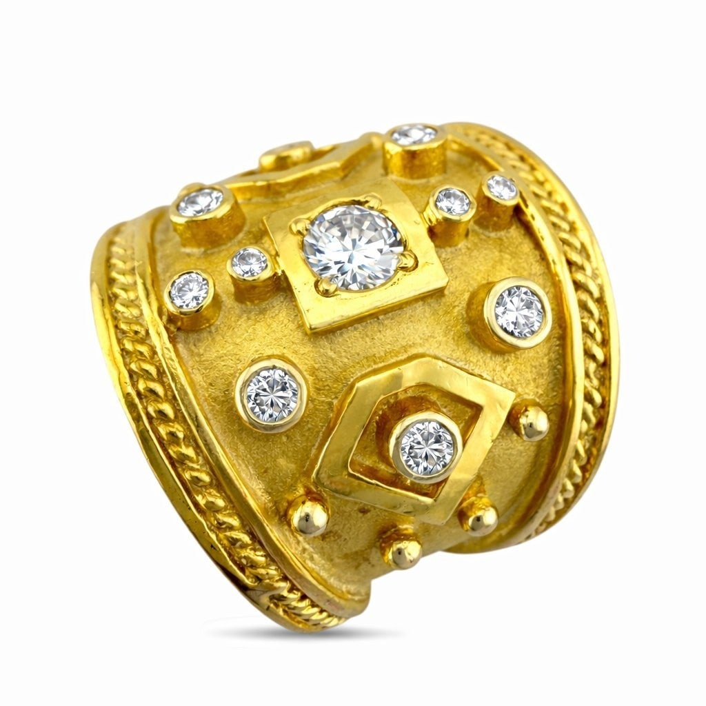 18K Yellow Gold 0.5ct Diamond Sculpted Ring: 18K Yellow Gold 0.5ct Diamond Sculpted Ring A bold sculptural ring crafted in rich yellow gold featuring a wide textured surface accented by dotted diamonds arranged across the face. The design center