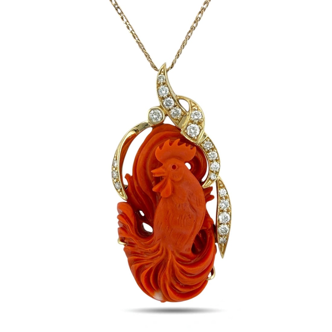 14K Yellow Gold Large Carved Coral and 1.15ct Diamond Rooster Pendant: 14K Yellow Gold Large Carved Coral and 1.15ct Diamond Rooster Pendant A magnificent 14K yellow gold pendant featuring an intricately carved coral rooster, capturing remarkable detail and artistry. The