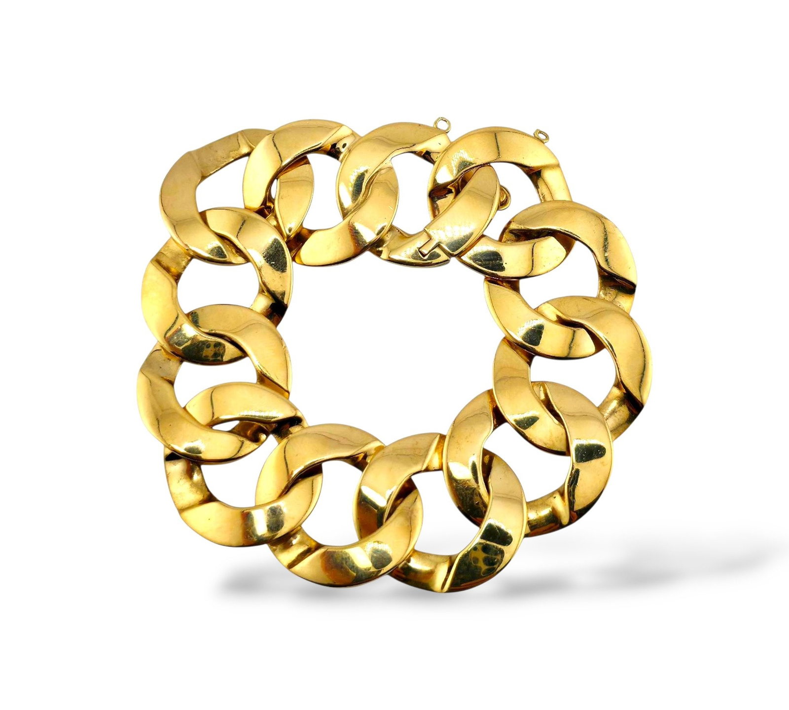 14K Yellow Gold Curb Link Bracelet: 14k Yellow Gold Curb Link Bracelet The polished finish enhances its luxurious weight and texture, ideal for collectors or those seeking a powerful everyday signature. 14K gold wide flattened curb link