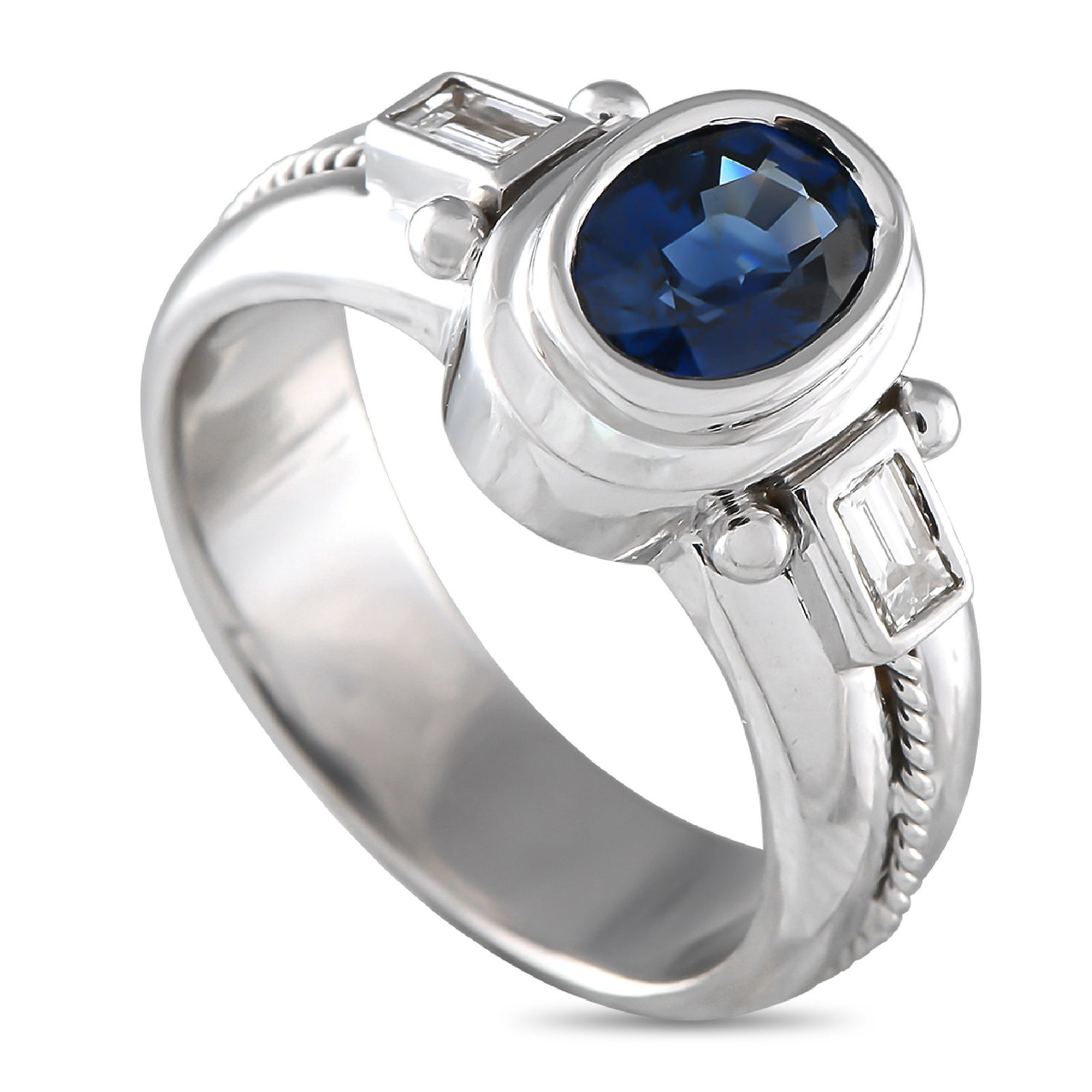 18K White Gold 0.32ct Diamond and Sapphire Ring: This luxury ring is poised to put the perfect finishing touch on any ensemble. An ornate 18K White Gold setting sets the stage for this exquisite accessory. An oval-shaped 1.55 carat Sapphire makes a 
