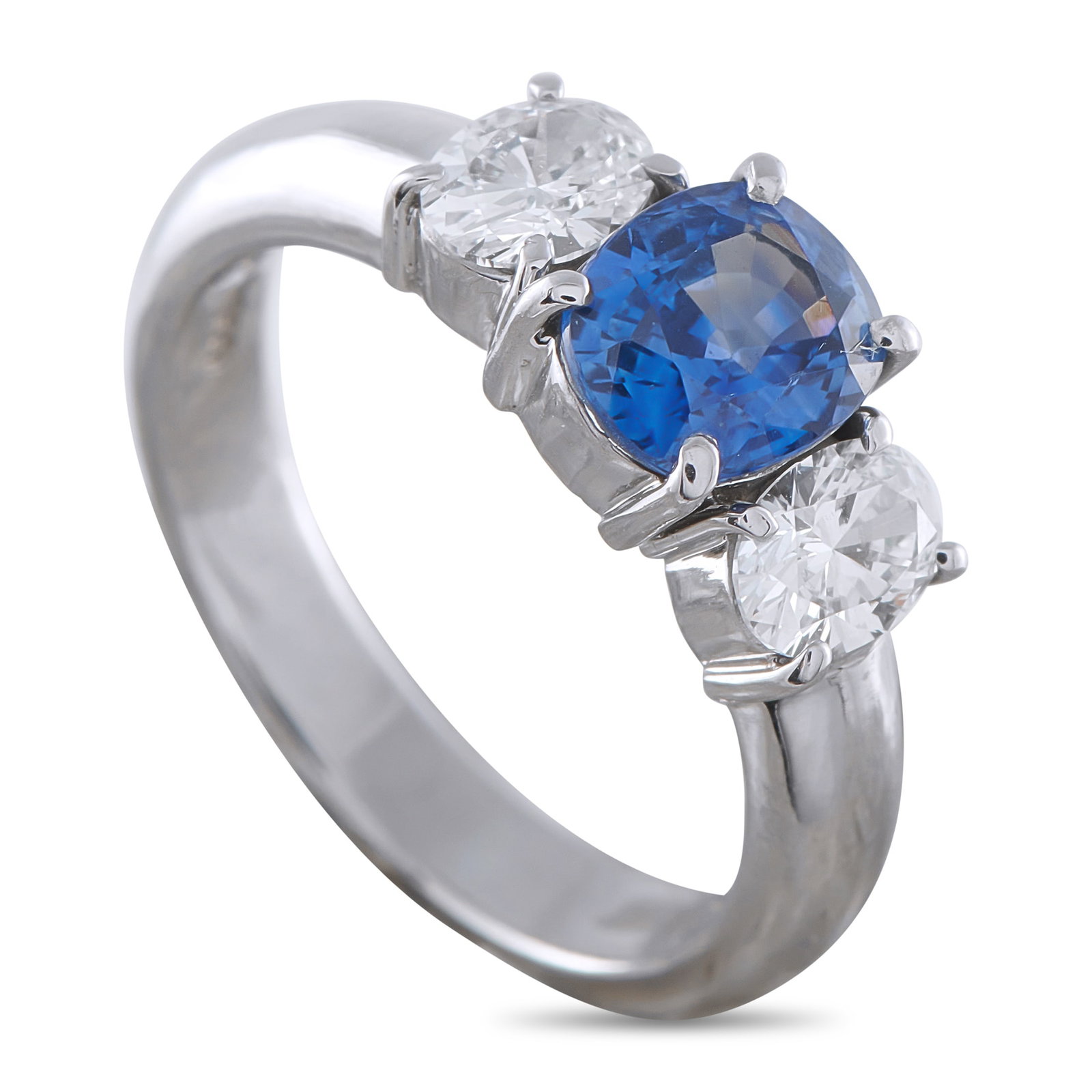Platinum 0.63ct Diamond and Sapphire Ring: This exquisite ring features a classic, elegant three-stone design. A 1.43 carat Sapphire center stone adds a stylish pop of color, while Diamonds totaling 0.63 carats provide a touch of traditional s