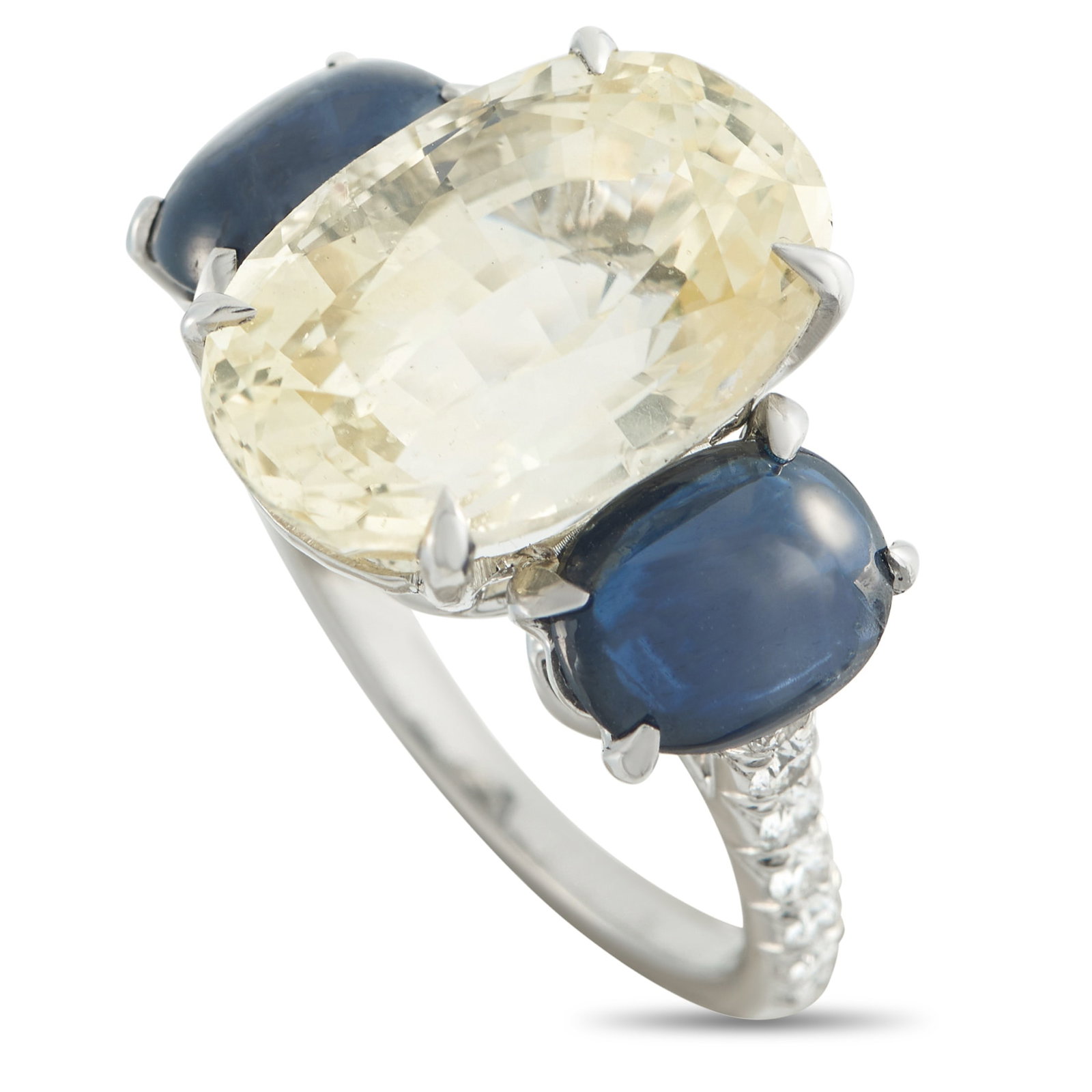 Platinum 0.45ct Diamond and Sapphire Ring: This uniquely elegant ring features a stunning combination of colors and textures. At the center, a translucent 12.6 carat Sapphire center stone is juxtaposed with Sapphire cabochons totaling 3.0 cara
