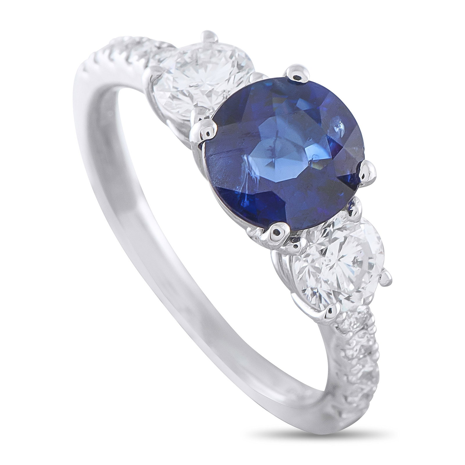 Platinum 0.77ct Diamond and Sapphire Ring: A 1.62 carat round-cut Sapphire makes a statement at the center of this exquisite luxury ring. Set in Platinum, Diamond accents totaling 0.77 carats flank the center stone and extend onto the band.