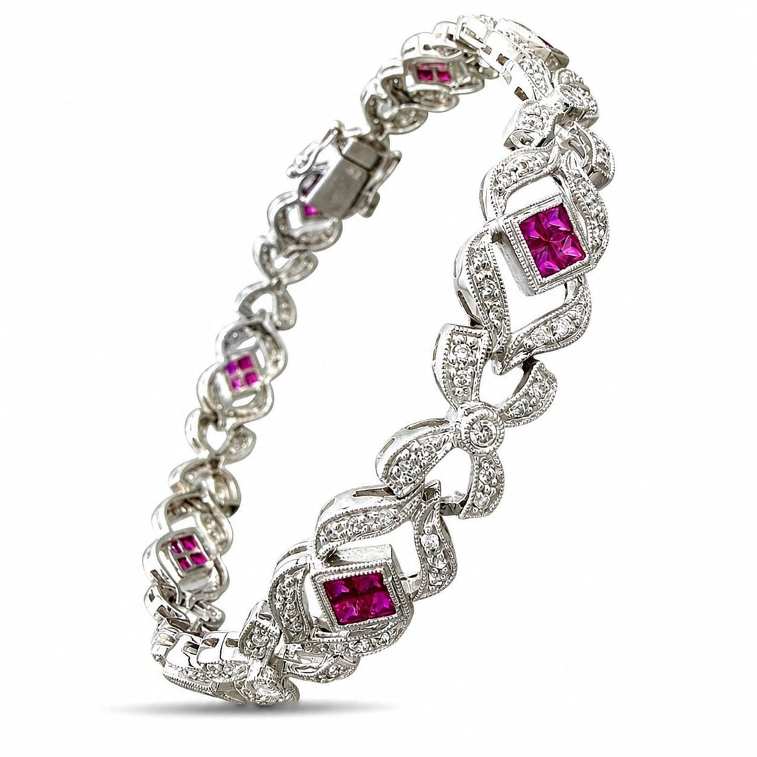 18K White Gold 2.0ct Diamond and 0.32ct Ruby Bracelet: 18K White Gold 2.0ct Diamond and 0.32ct Ruby Bracelet This 18K white gold bracelet features an ornate articulated design accented with diamonds and square rubies set in a repeated square pattern acros