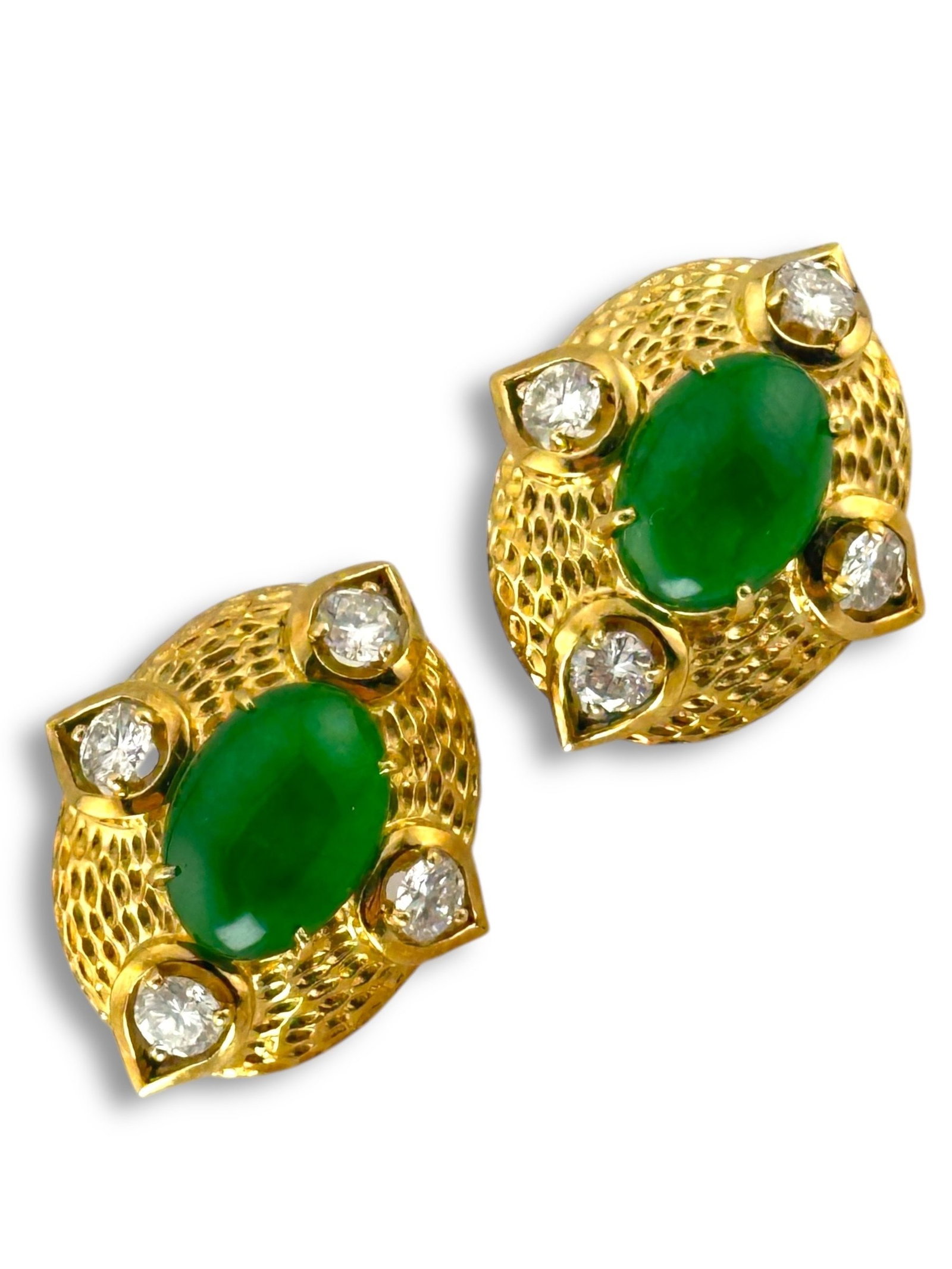 14K Oval Earrings with Diamonds: 14K Oval Earrings with Diamonds These elegant oval-shaped earrings are crafted in radiant 14K yellow gold and feature a striking green gemstone at the center of each piece. Encircling the vibrant