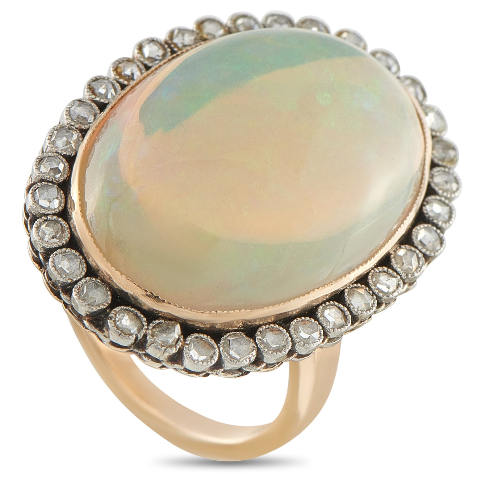 Antique 18K Rose Gold 0.70ct Diamond and Opal Cocktail Ring: A rare find. This antique cocktail ring carries the presence of a well-preserved heirloom. It features an 18.0 carat oval white opal, in cabochon cut, resting on a softly ridged bezel that underscores