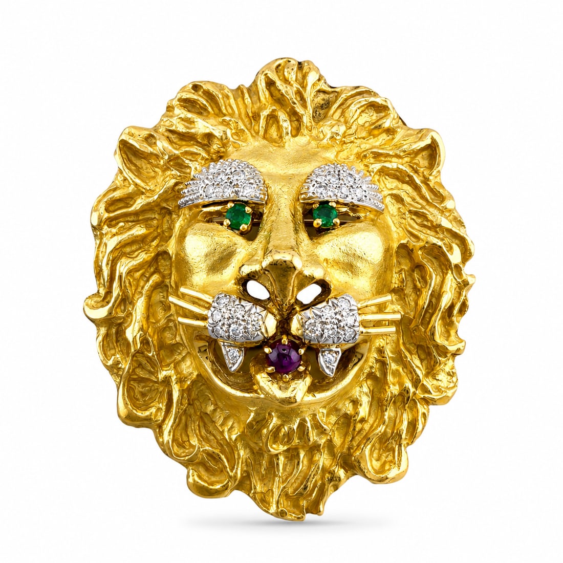 Hammerman Brothers 18K Yellow Gold Lion Emerald t Ruby and Diamond Large Brooch: Exclusive 18K Yellow Gold Lion Emerald t Ruby and Diamond Large Brooch his 18K yellow gold lion brooch by H.B features a bold sculptural lion face design with emerald eyes, diamond accents, and a red 