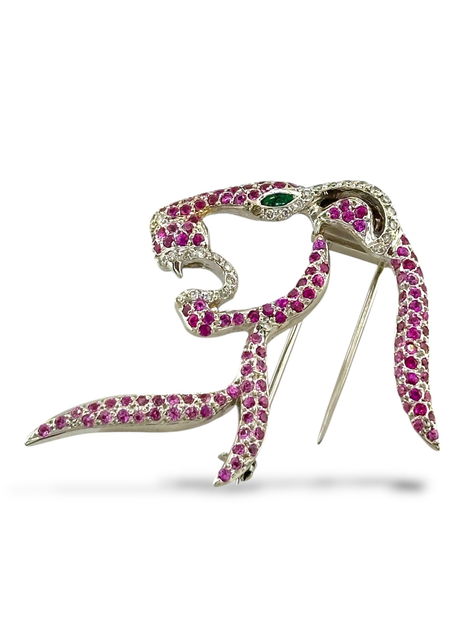 14K White Gold Panther Brooch with Pink Sapphires, Diamonds and Emerald Eye: 14K White Gold Panther Brooch with Pink Sapphires, Diamonds and Emerald Eye A fierce emblem of elegance and power, this 14K white gold panther brooch is brought to life with a vivid array of gemstones