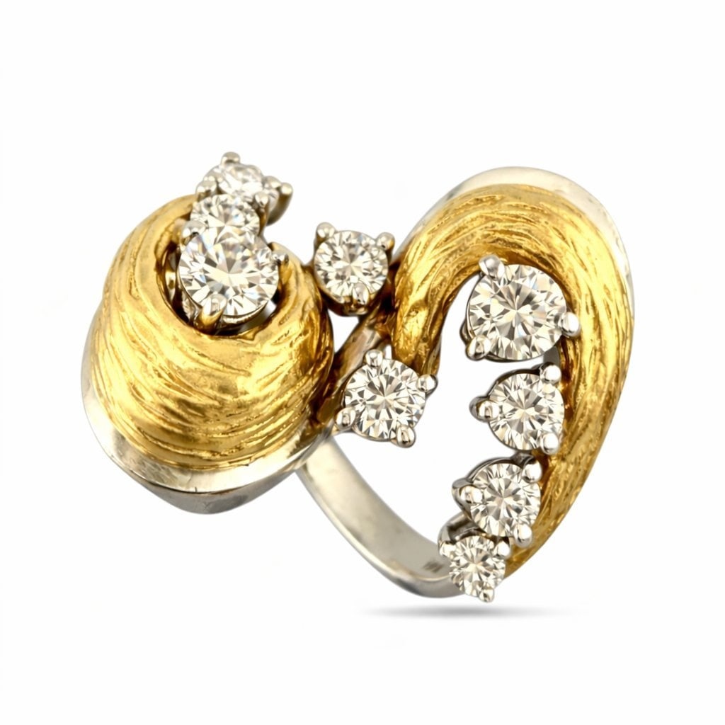 18K Yellow and White Gold Twisting 0.6ct Diamond Ring: 18K Yellow and White Gold Twisting 0.6ct Diamond Ring This striking vintage ring features an elegant twisting design crafted in both rich yellow gold and bright white gold. The sculptural form curves 