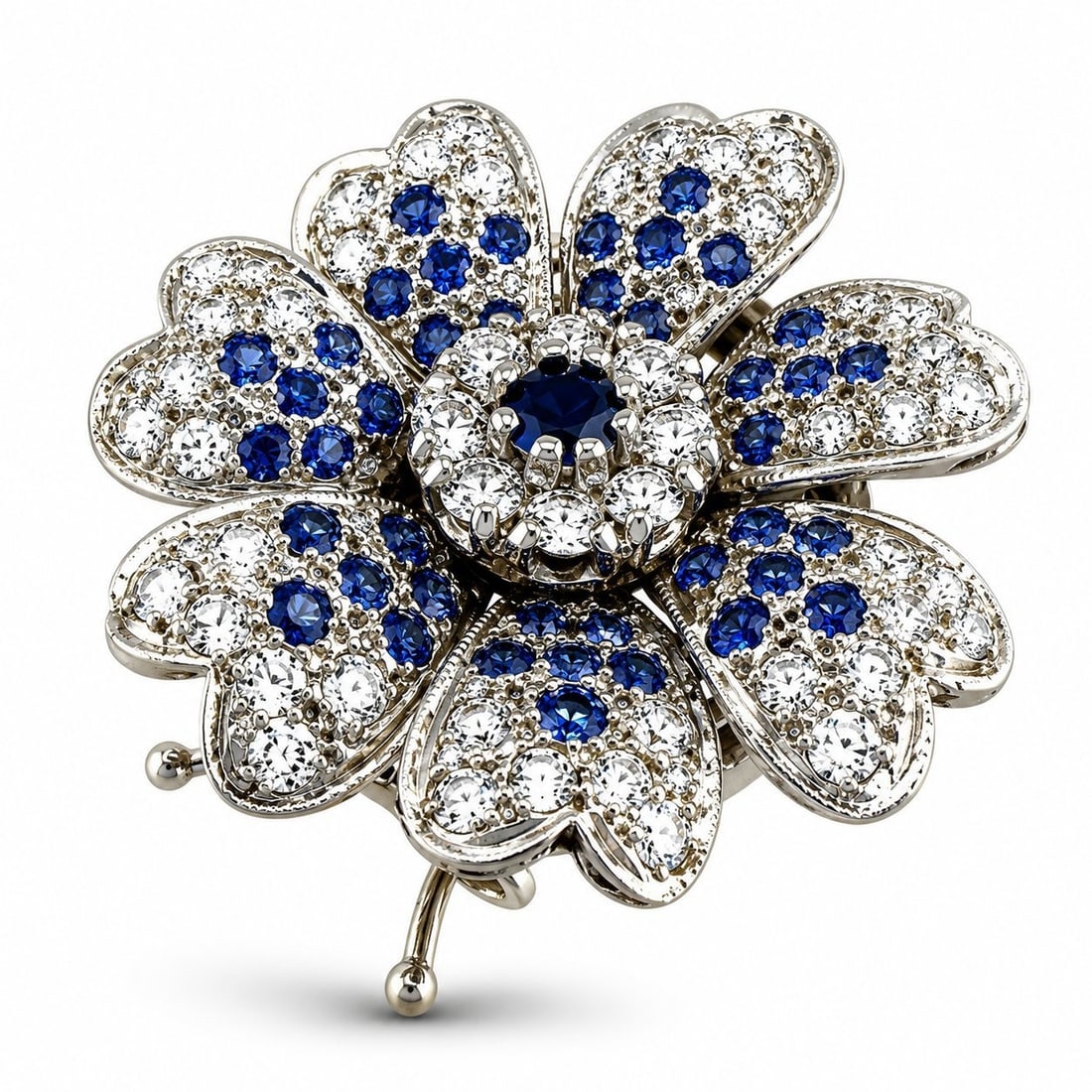 14K White Gold 1.60ct Diamond and 1.15ct Sapphire Flower Brooch: 14K White Gold 1.60ct Diamond and 1.15ct Sapphire Flower Brooch A beautiful vintage flower brooch crafted in 14 karat white gold, designed with a rounded floral form and a sapphire center. The layered