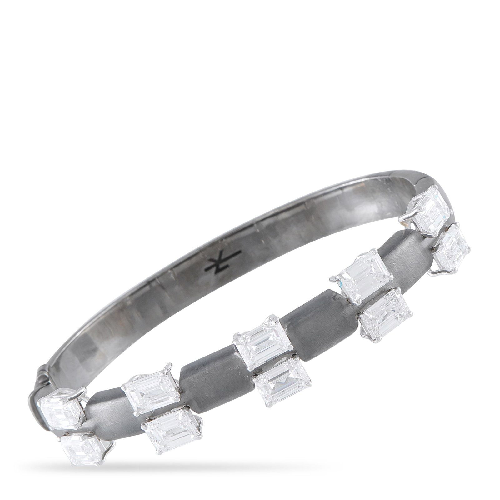 Nikos Koulis 18K White Gold and Titanium 10.19ct Diamond Bracelet: An understated design makes this Nikos Koulis bracelet ideal for anyone who appreciates modern luxury. GIA-Certified emerald cut Diamonds with a total weight of 10.19 carats make a statement on this s