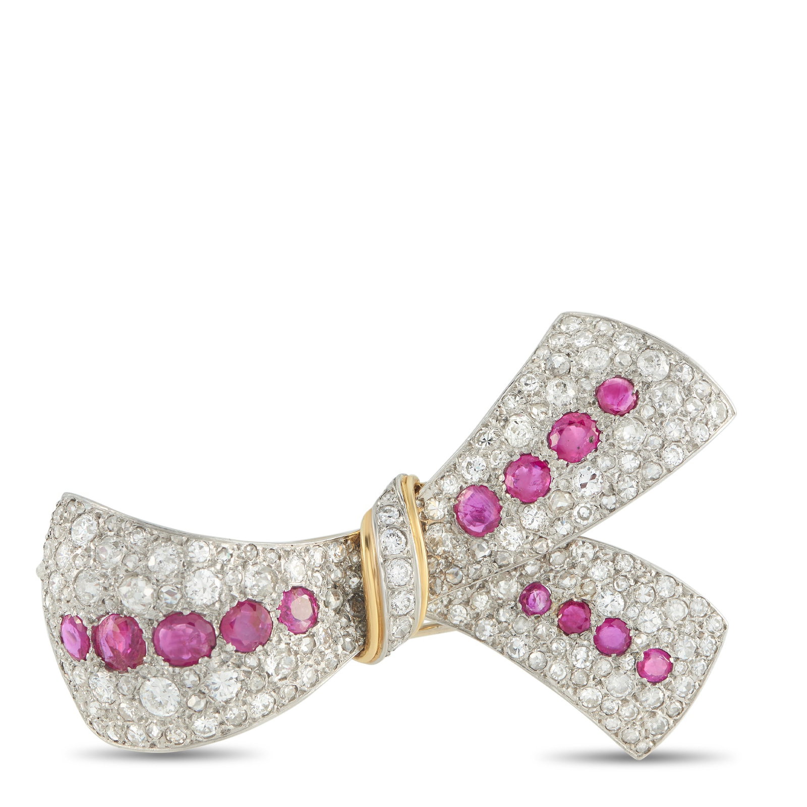 Platinum and 18K Yellow Gold 5.50ct Diamond and Ruby Bow Brooch: A modest footprint with a bright reach. This platinum brooch offers an approachable form, yet its light-play is impossible to ignore. It features a dense field of diamonds totaling 5.50 carats, intent