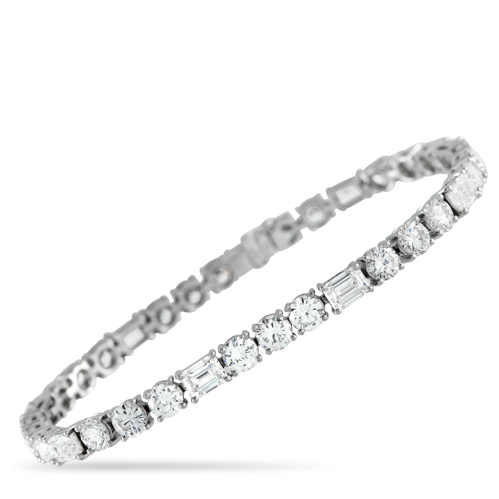 18K White Gold 13.10ct Diamond Tennis Bracelet: This tennis bracelet offers a unique take on a classic accessory. A combination of round cut Diamonds totaling 8.50 carats and emerald cut Diamonds totaling 4.60 carats make it a luxurious addition to