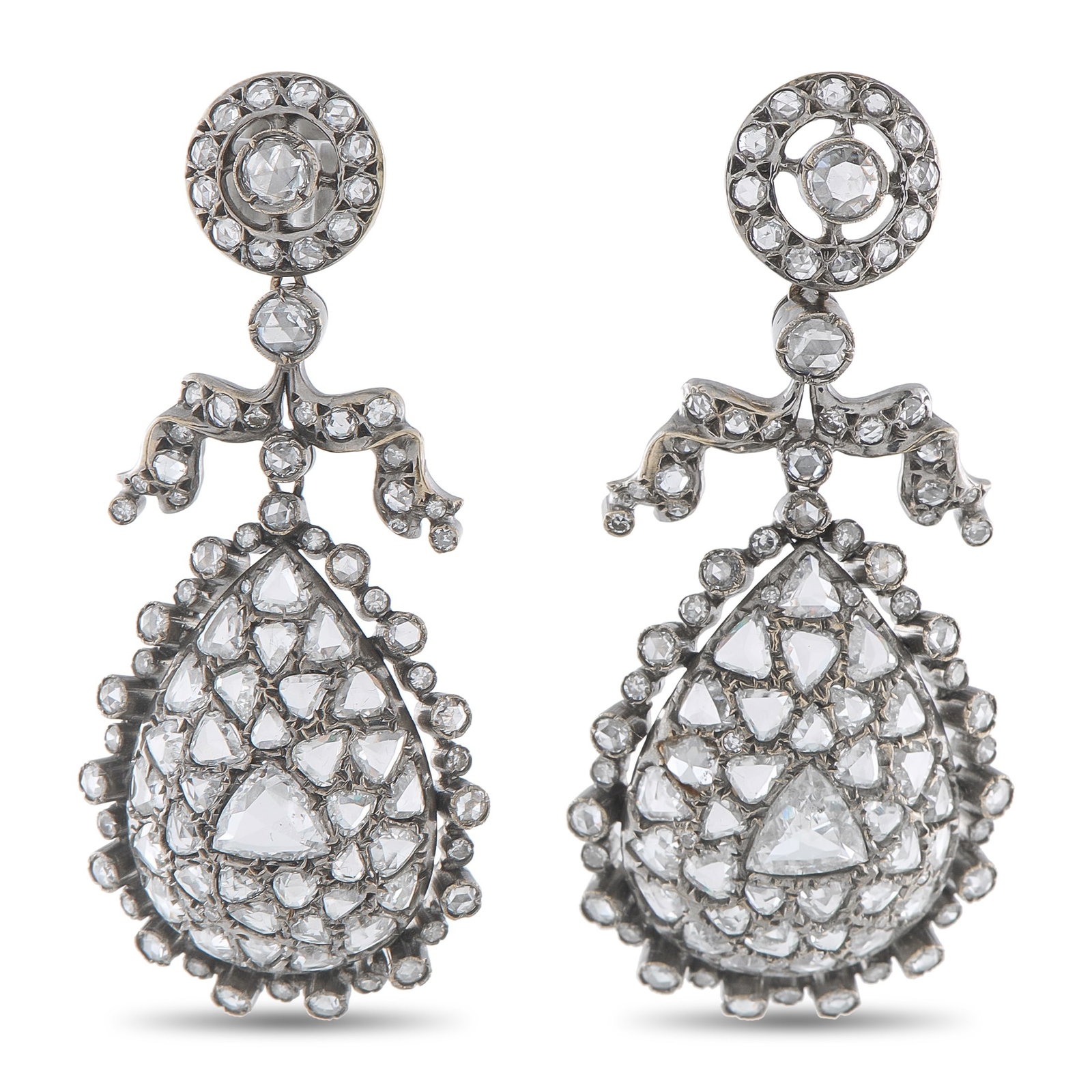 Fred Leighton 18K White Gold 8.37ct Diamond Earrings: Incredibly ornate, these Fred Leighton earrings feature a classically elegant design that will continually captivate. Every dynamic detail is elevated by inset Diamonds totaling 8.37 carats. Set in 18