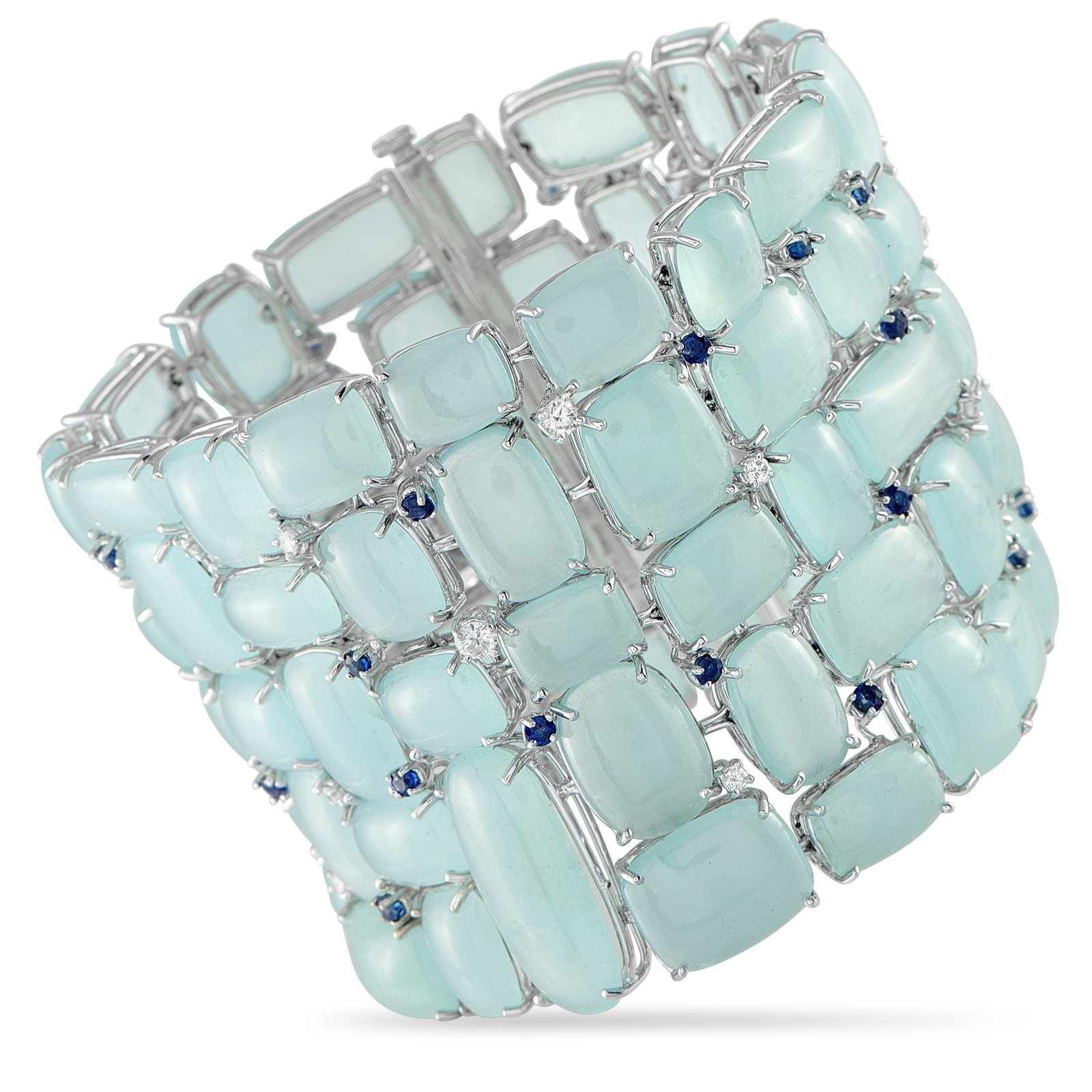 Sophia D 18K White Gold 0.85ct Diamond, Sapphire and Moonstone Bracelet: A sculptural cuff by Sophia D, this piece stuns with 246.7 carats of moonstone cabochons, set in a flowing, pebble-like pattern. Petite sapphires in dark blue and brilliant white diamonds add flickers