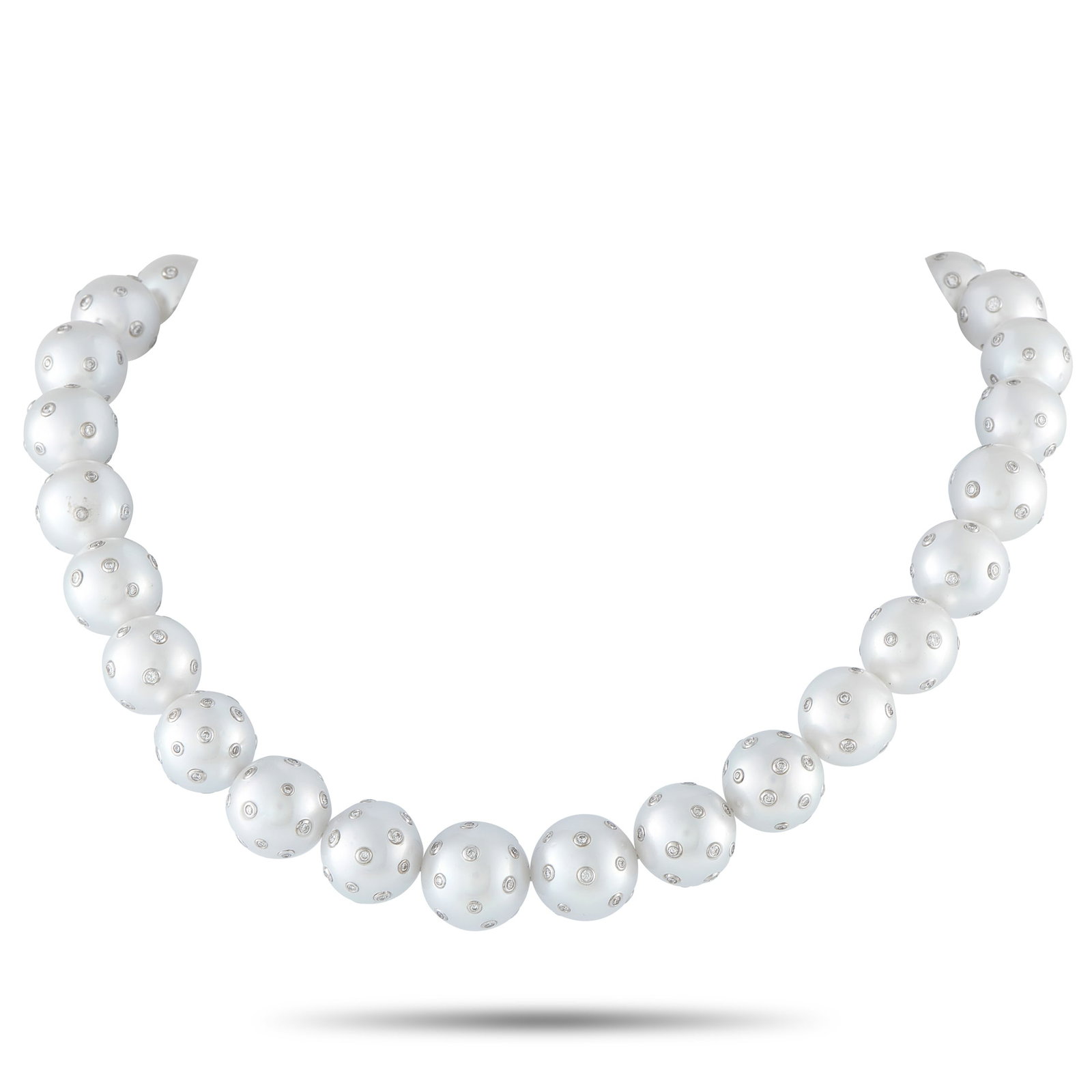 18K White Gold 3.0ct Diamond and Pearls Necklace: A classic strand, marked by an uncommon surface. A single 15-inch line of 12mm-15mm white pearls creates a full presence at the neck. Each pearl is punctuated with multiple diamonds set flush into the
