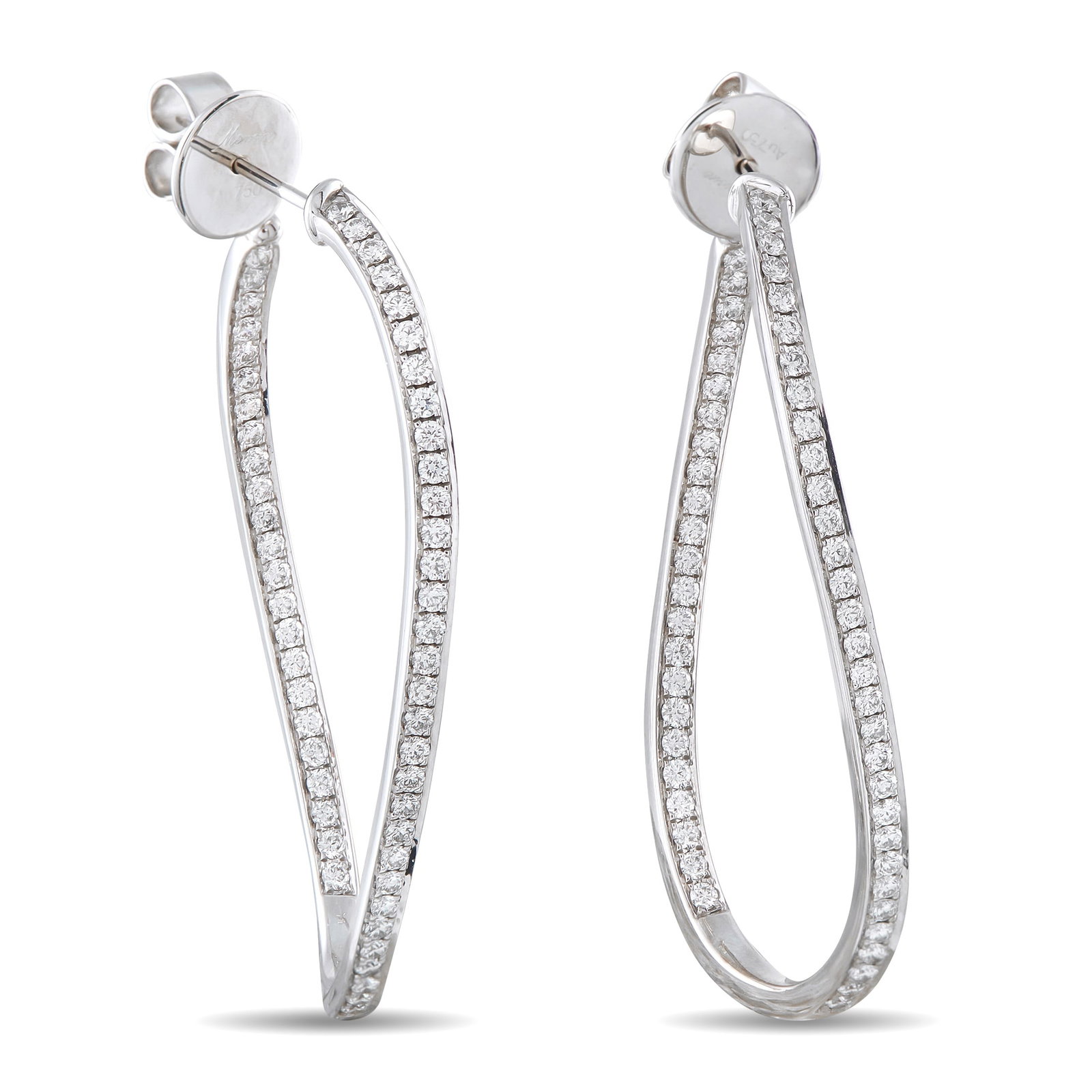 Memoire 18K White Gold 1.50ct Diamond Twist Inside-Out Hoop Earrings: These Memoire twist hoop earrings are chic and incredibly contemporary. Curved lines elevate the classic 18K White Gold settings, which come to life thanks to sparkling Diamonds totaling 1.50 carats. 