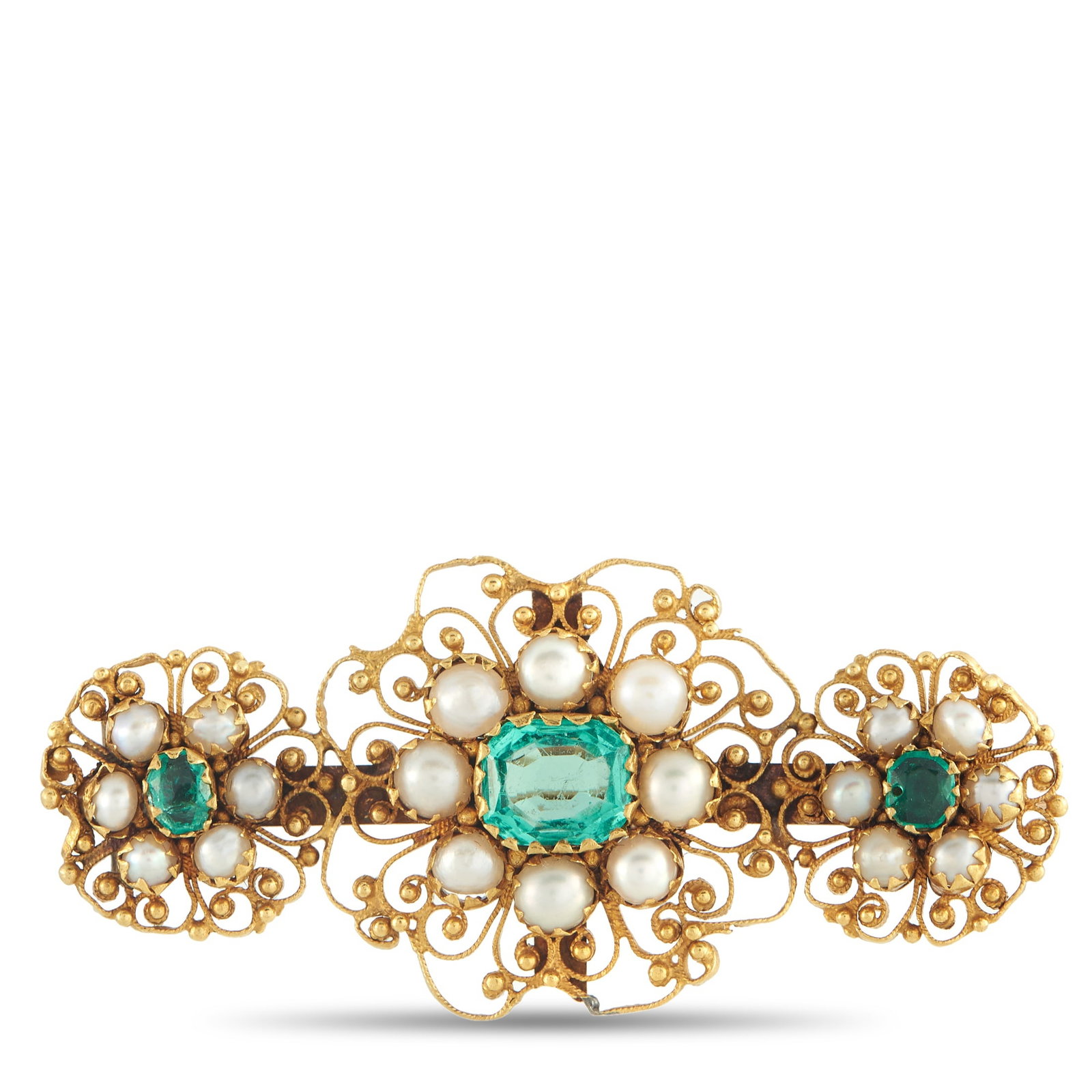 18K Yellow Gold 1.10ct Emerald Brooch: Intricate metalwork makes this brooch simply exquisite. The breathtaking design is elevated by pearlescent accents, while Emeralds totaling 1.10 carats ensure it always catches the light. Crafted from
