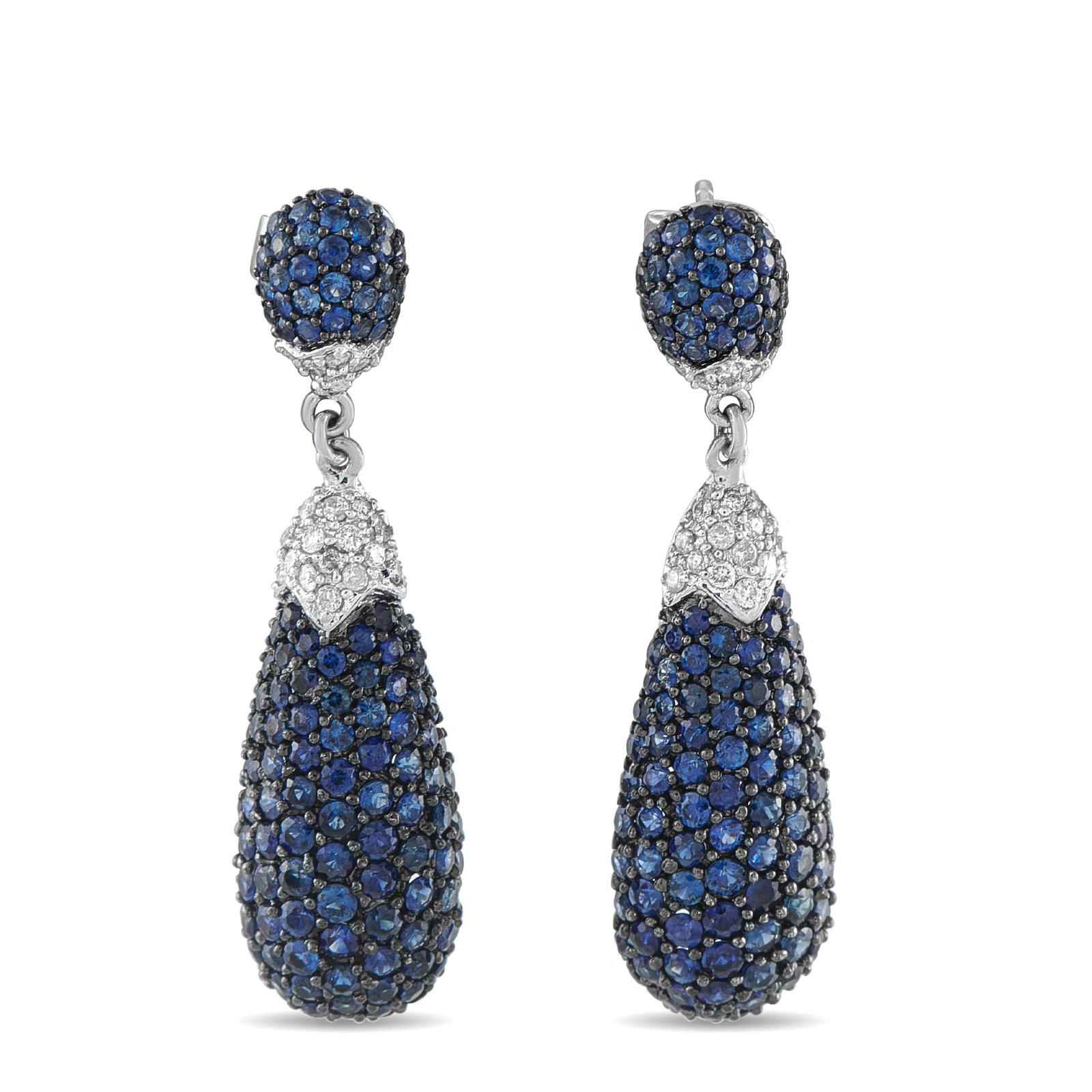 18K White Gold 0.40ct Diamond and Sapphire Drop Earrings: Dramatic and beautifully proportioned, this estate pair of drop earrings cascades with 2.20 carats of intensely blue sapphires across a multi-tiered pave design. Each earring opens with a domed sapphi