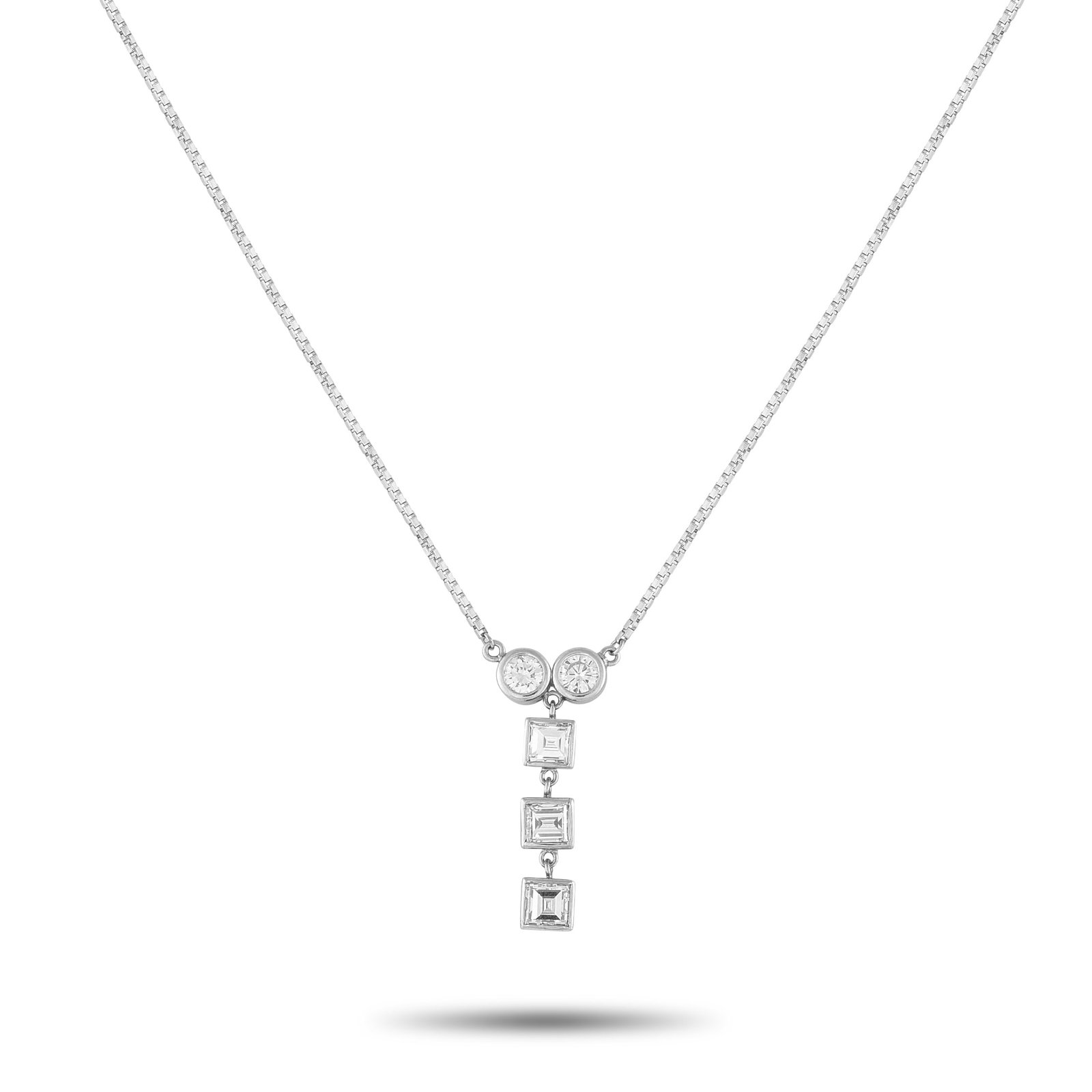 Platinum 1.41ct Diamond Necklace: Circles meet squares in this diamond necklace. The pendant begins with two bezel-set round diamonds side by side, their radiant shine giving way to a vertical drop of three square-cut diamonds in slee