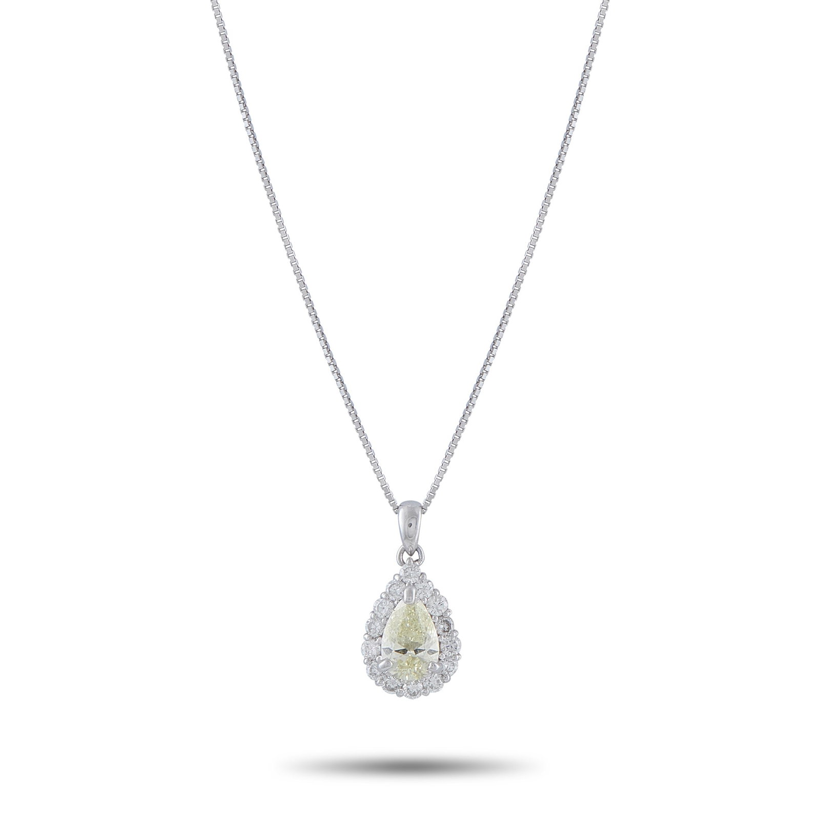 Platinum 1.45ct Diamond Pendant: This necklace will add a subtle touch of sparkle to any outfit. Set in Platinum, it features a 1.0 pear shaped Diamond center stone by a halo of Diamonds totaling 0.45 carats. The pendant measures