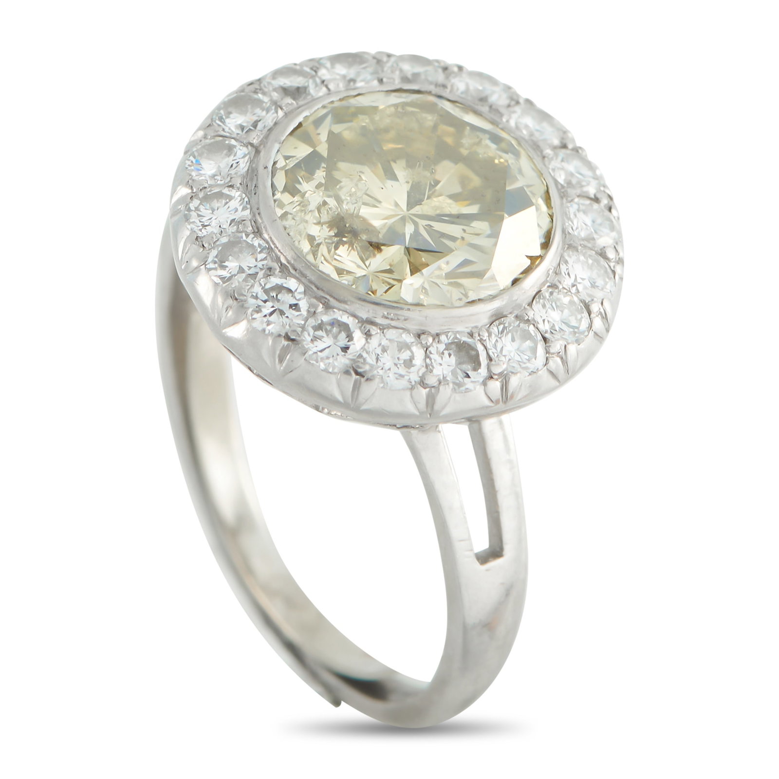 Platinum 3.99ct Diamond Ring: This radiant ring is designed to continually catch the light. At the center, a 3.45 carat Diamond adds a touch of warmth to the overall design. A halo of additional Diamonds totaling 0.54 carats makes