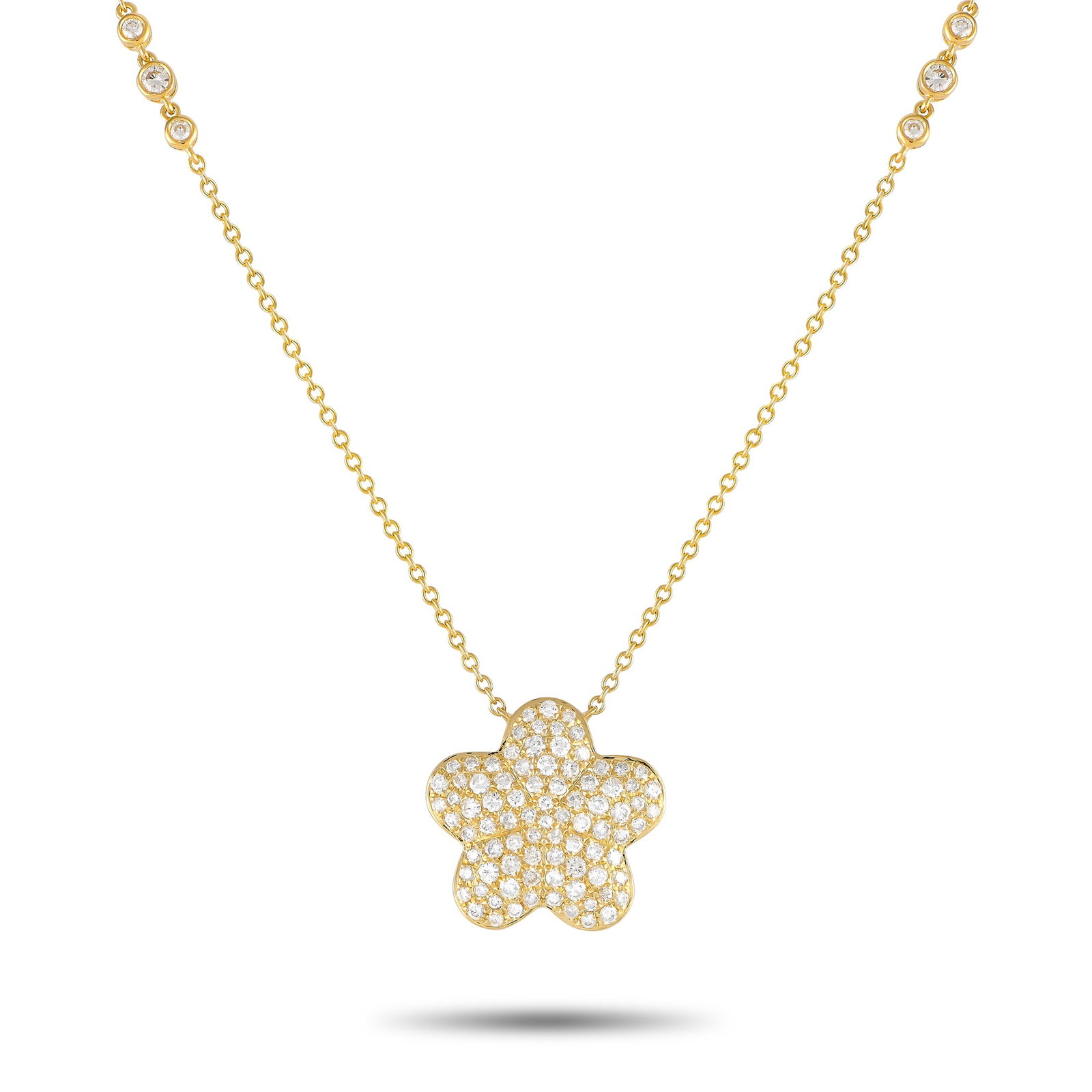 18K Yellow Gold 1.25ct Diamond Necklace: This exquisitely crafted necklace will continually captivate. Diamonds with a total weight of 1.25 carats accent the 18” chain as well as the flower-shaped pendant at the center of the design. C