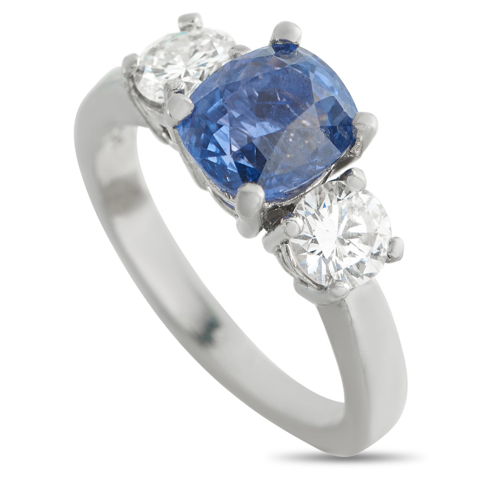 Platinum 1.0ct Diamond and Sapphire Ring: This luxury ring is simple, elegant, and ideal for any occasion. Set in Platinum, the traditional three-stone design features a 3.22 carat Sapphire center stone surrounded by Diamonds with a total